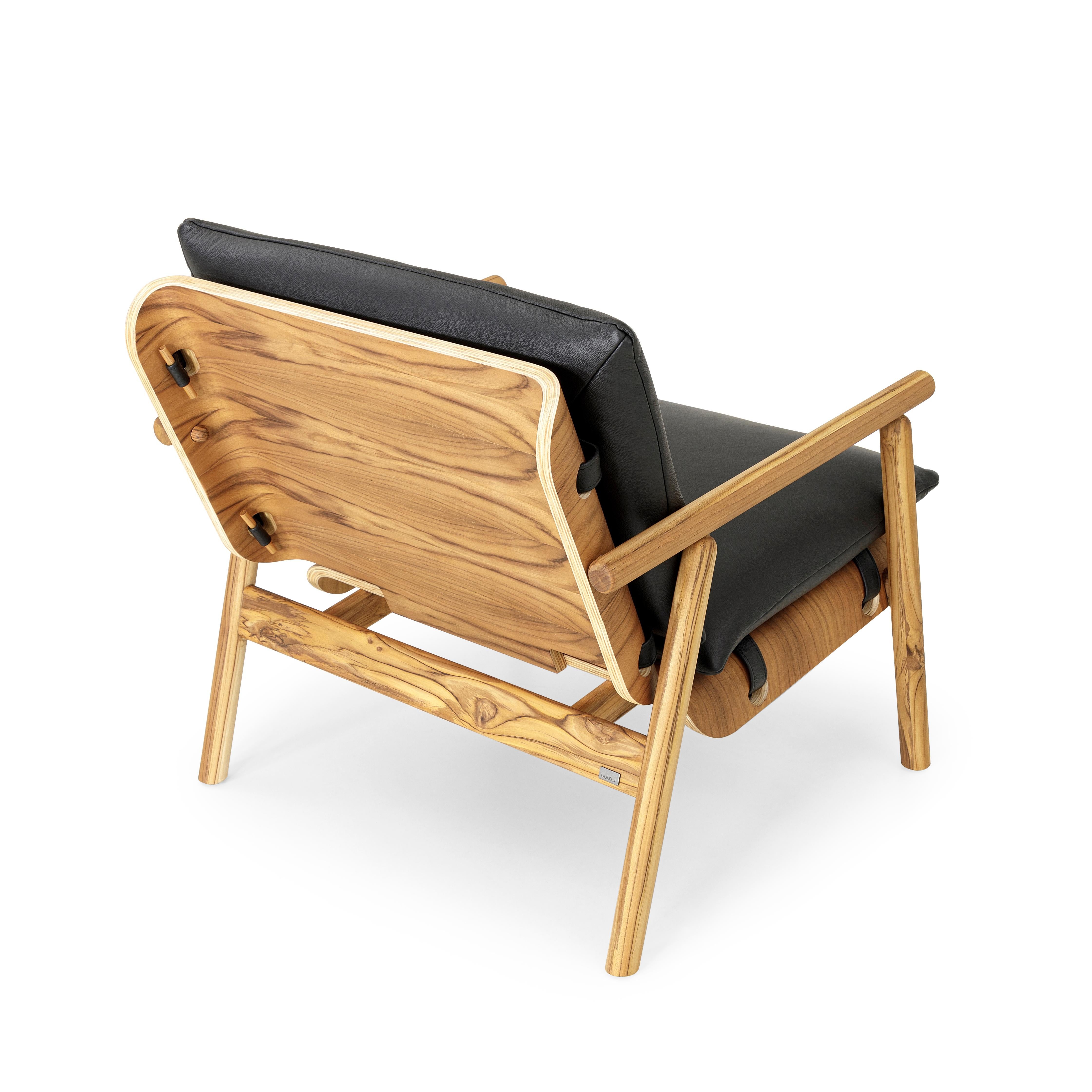 Contemporary Tai Armchair in Teak Wood Finish with Black Leather Cushions For Sale