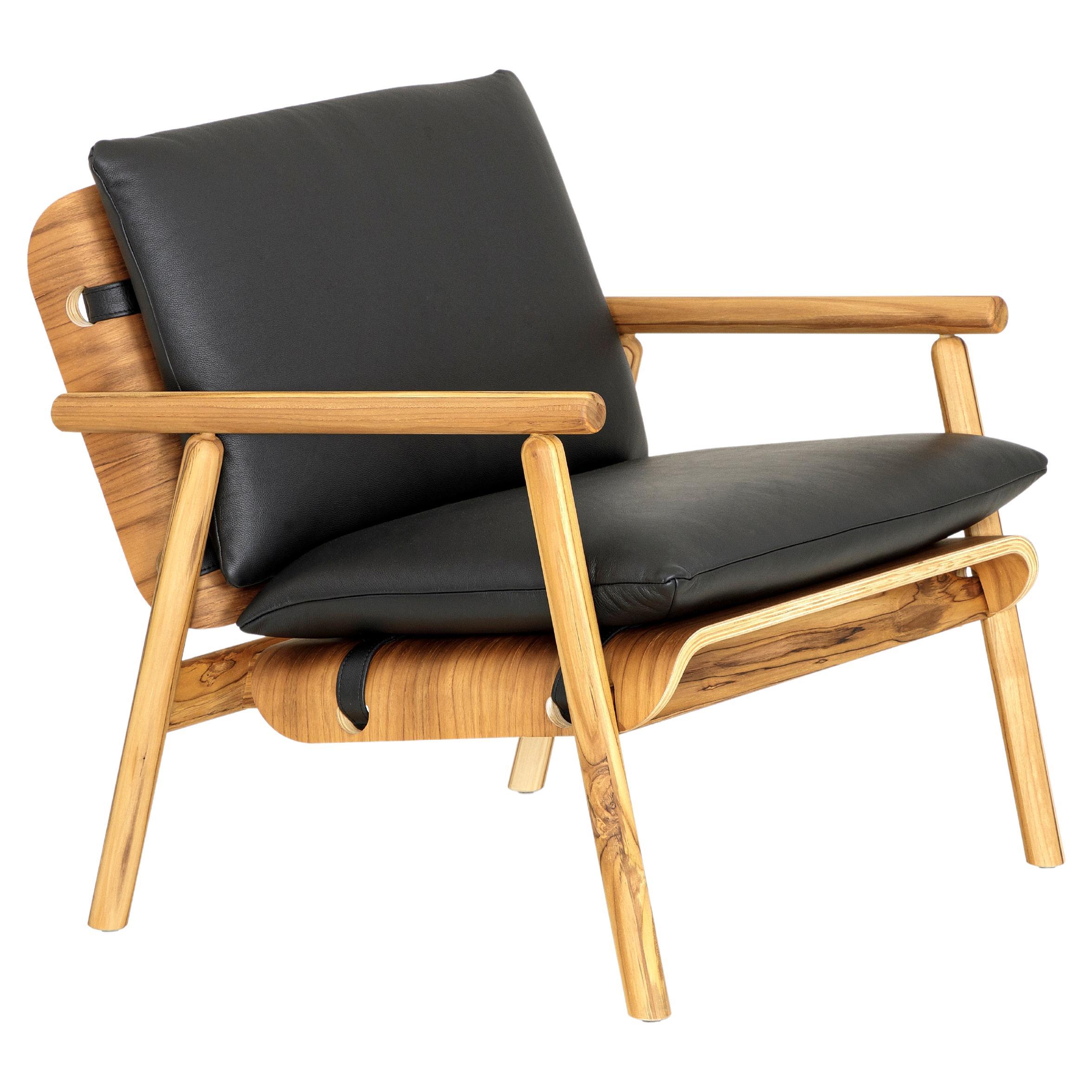 Tai Armchair in Teak Wood Finish with Black Leather Cushions For Sale