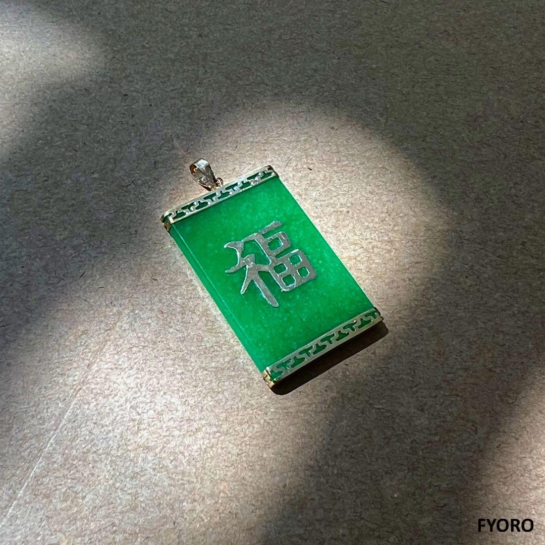 Symbolizing generosity, the Tai Locket Fu Fuku Fortune Jade Pendant represents traditional sharing of wealth during Chinese New Year. The generous proportions depict wealth and boldness.

Made out of Jadeite, with a solid 14K Yellow Gold character