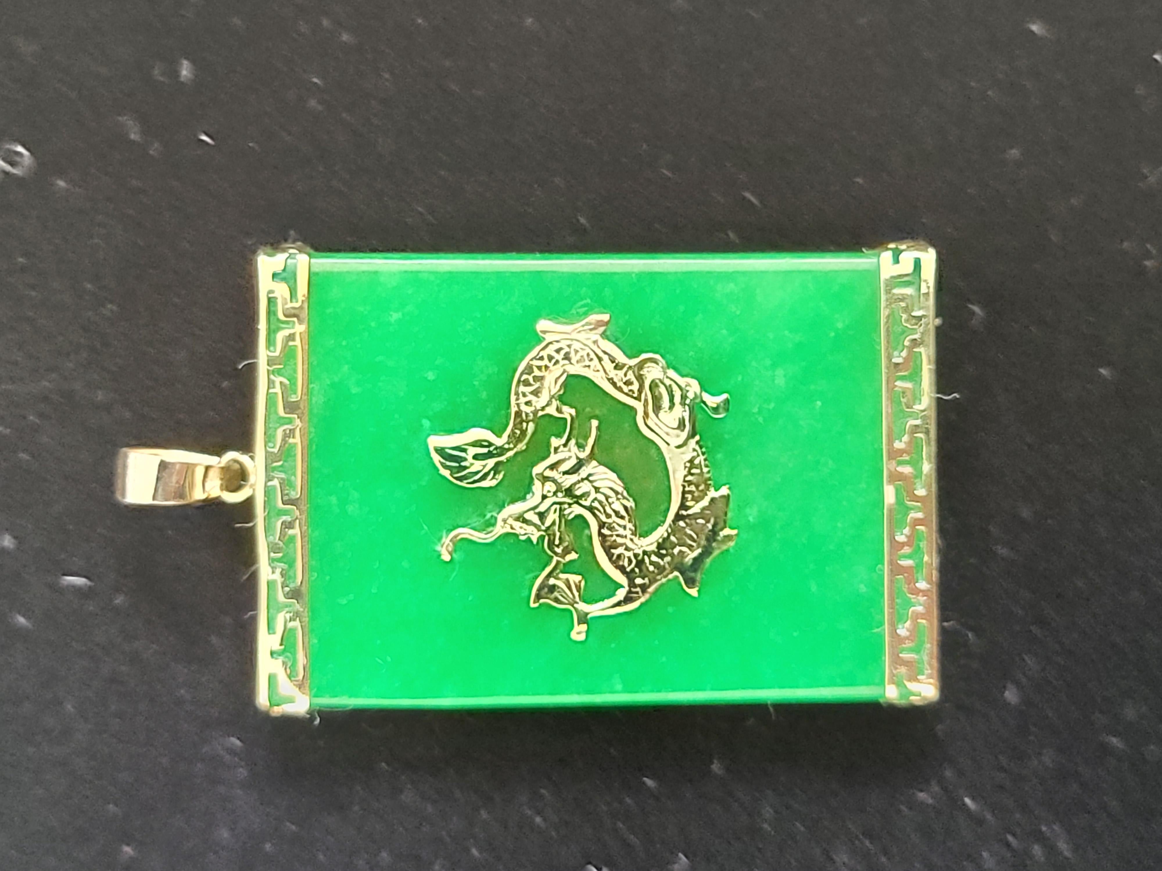 Symbolizing generosity, the Tai Locket Jade Dragon Pendant represents traditional sharing of wealth during Chinese New Year with the power of the Dragon. The generous proportions depict wealth and boldness.

Made out of Jadeite, with a solid 14K