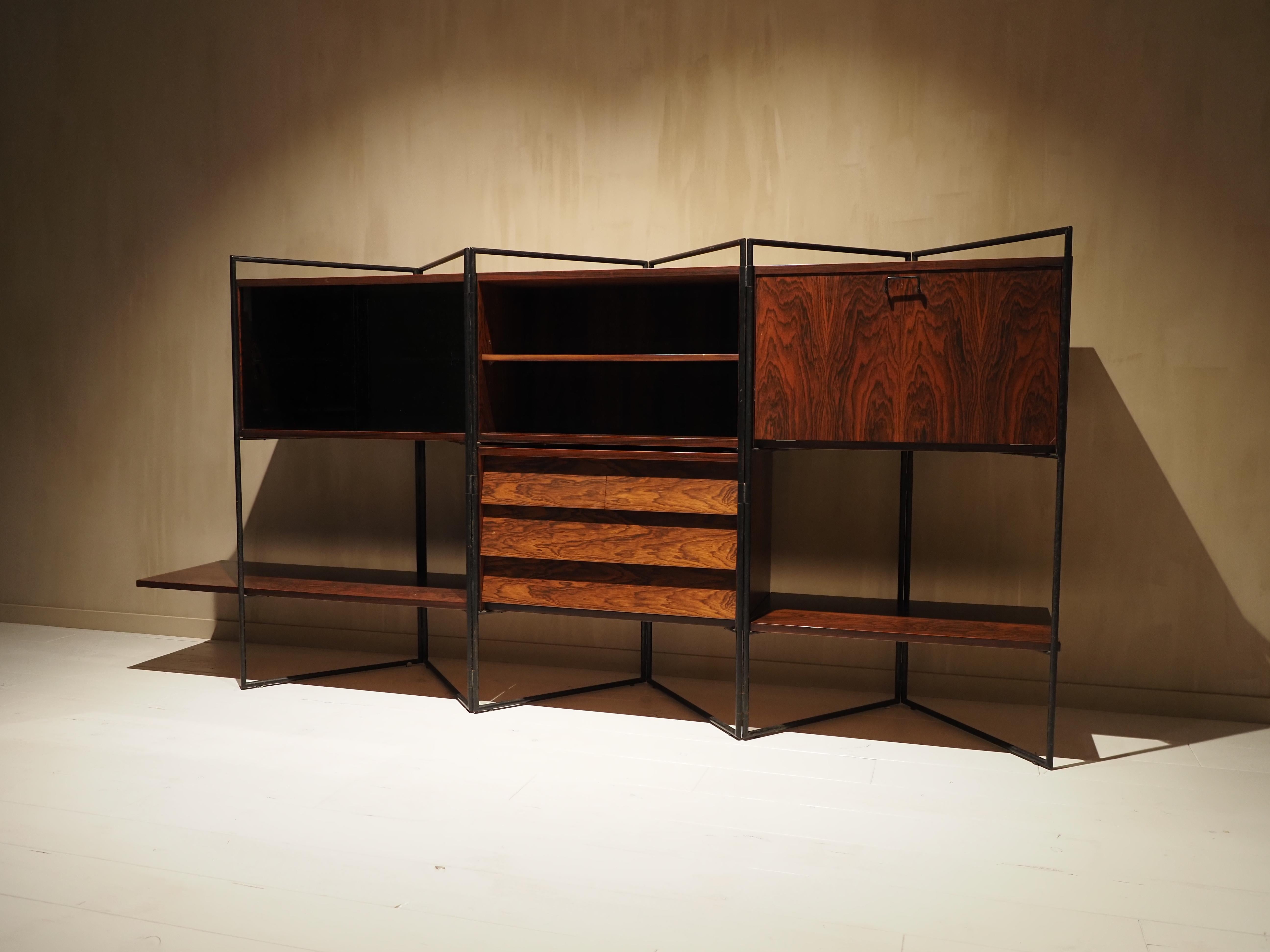 Taichiro Nakai (Japan) for La Permanente Mobili, bookcase, lacquered iron, teak, glass, brass, maple, ca. 1953. 

He worked to the international recognition of Japanese design. One of the only elements known about Taichiro Nakai is this one: he