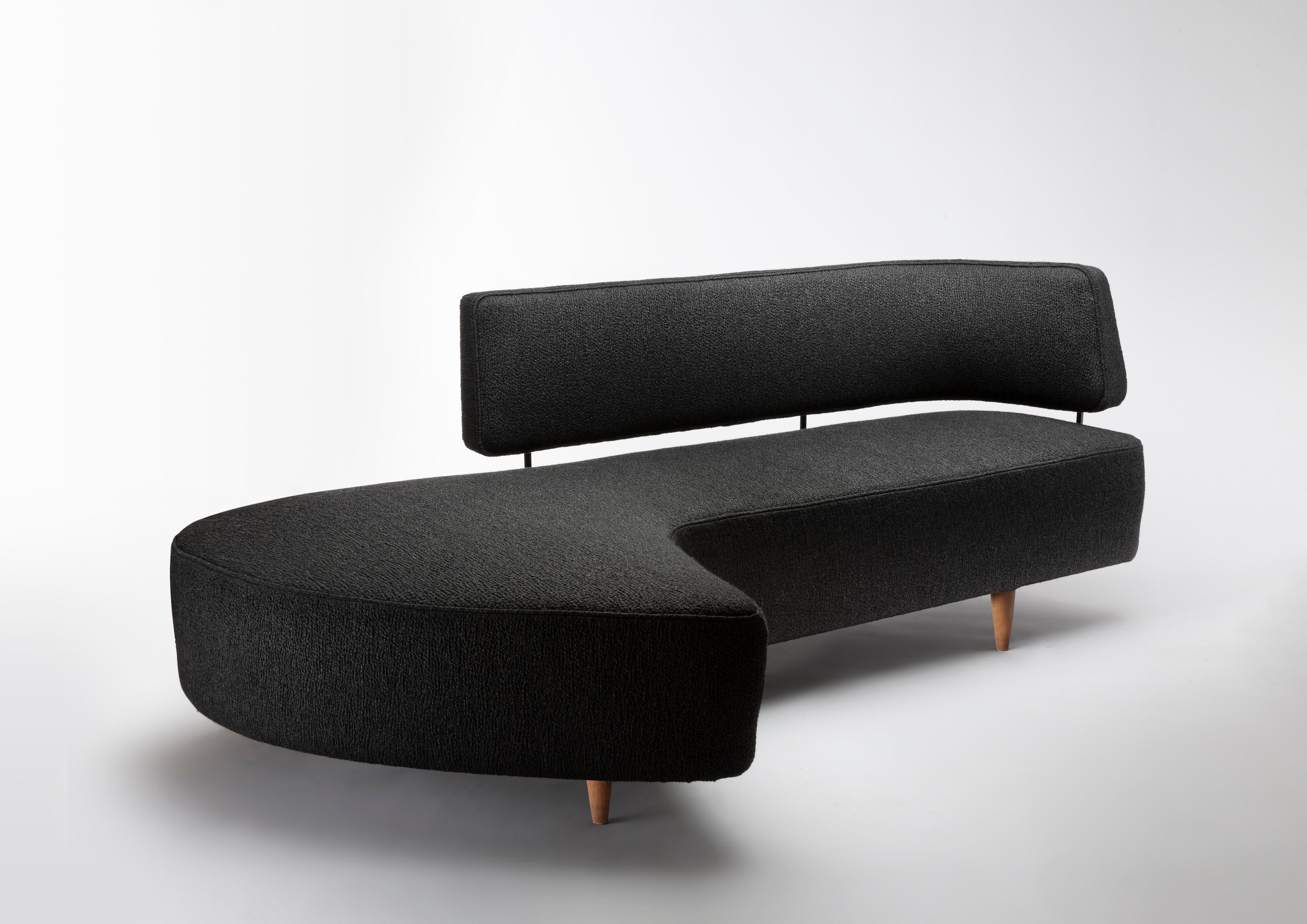 A rare freeform sofa by the Japanese designer Taichiro Nakai, in cherry wood, black lacquered metal and flecked fabric, manufactured by La Permanente Mobili, Italy, circa 1955
A similar model was designed for and shown during the exhibition “La