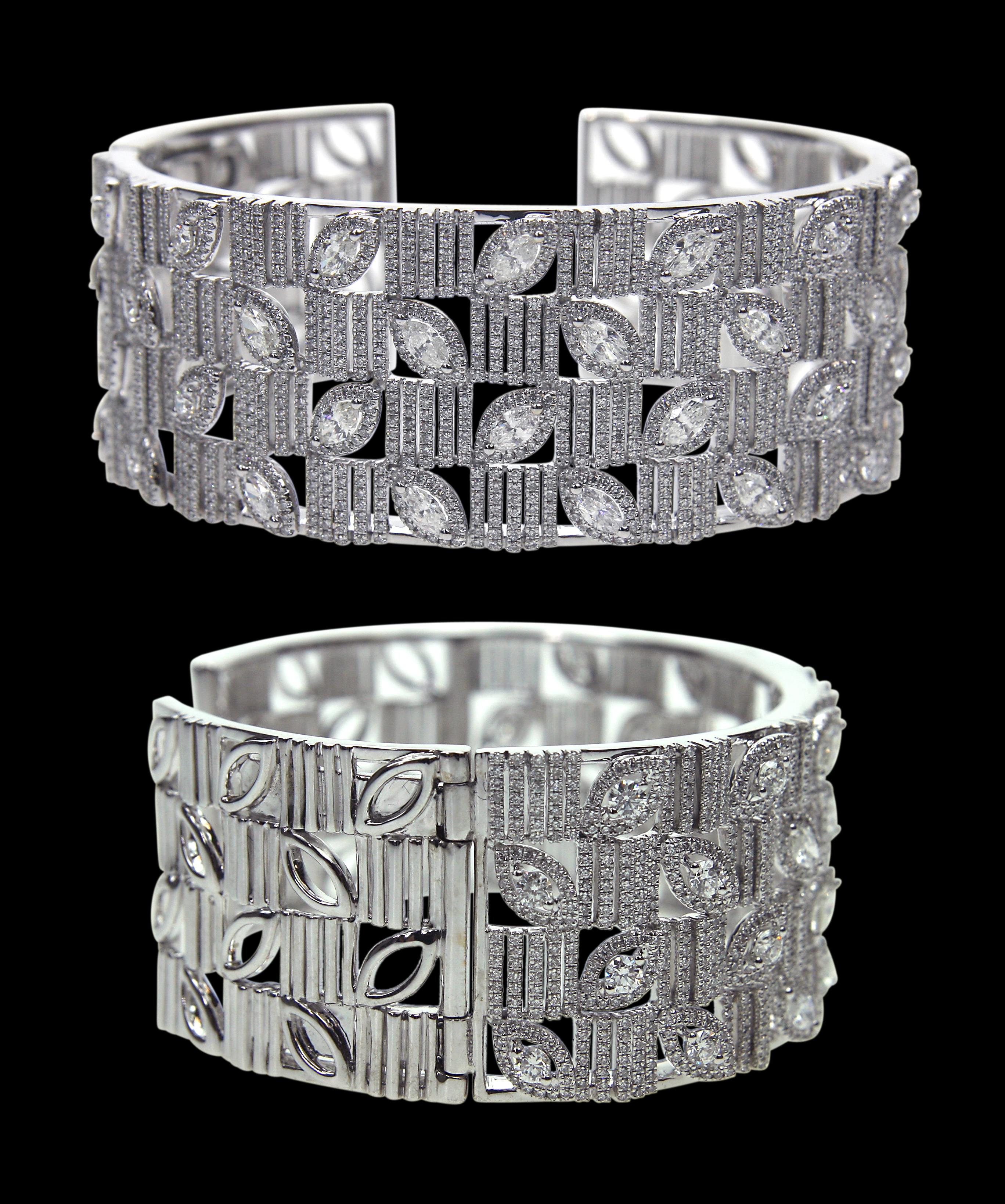 Tailor Made 18 Karat White Gold And Diamond Bracelet 

Bangles:
Diamonds of approximately 7.323 carats, mounted on 18 karat white gold bracelet. The Bangle weighs approximately around 70.195 grams.

Please note: The charges specified do not include