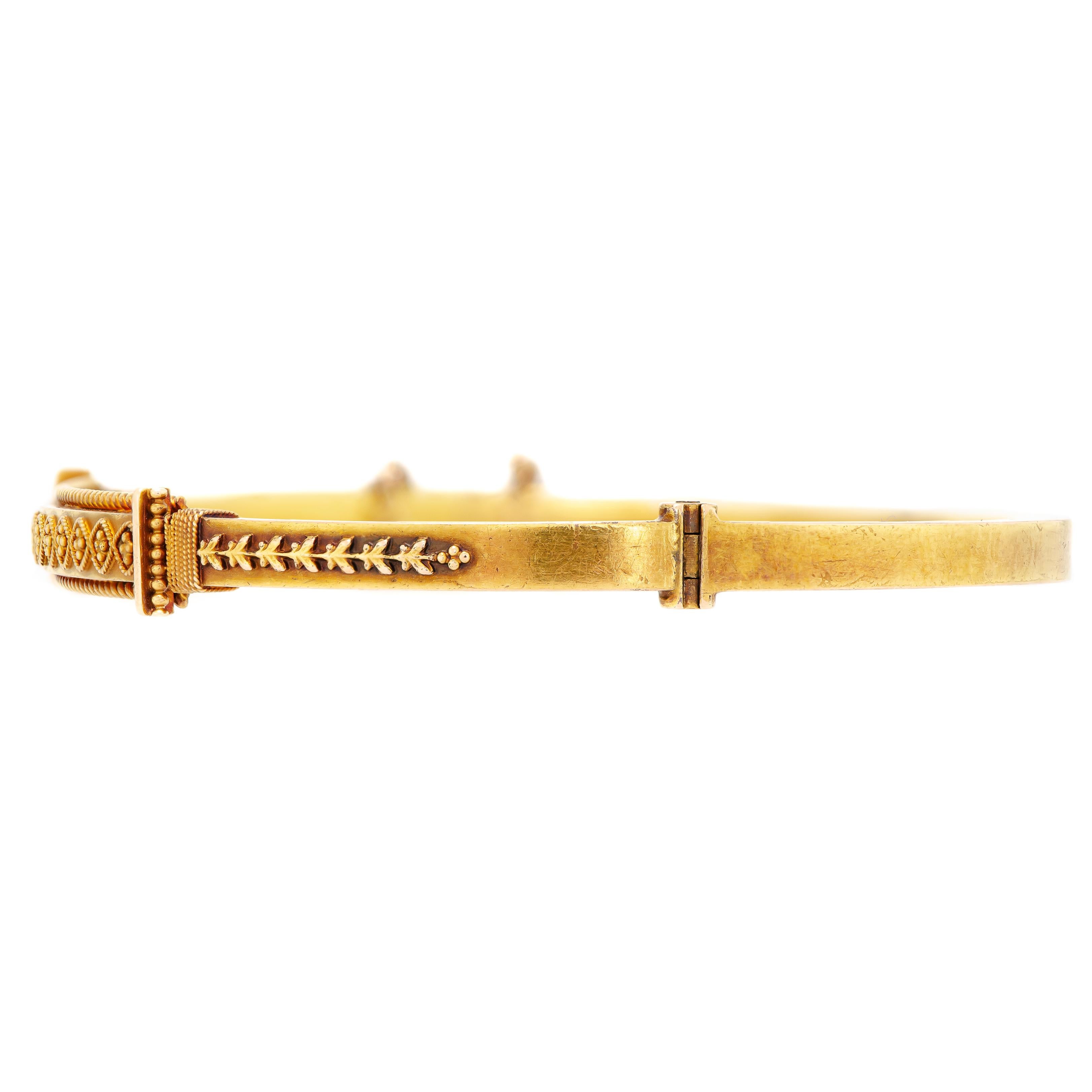 Beautiful gold hinged bangle bracelet from the Victorian Era, circa 1890 slim bracelet constructed of rich 15kt yellow gold with applied Etruscan wire and beadwork, gold safety chain for added security - English - inside circumference of