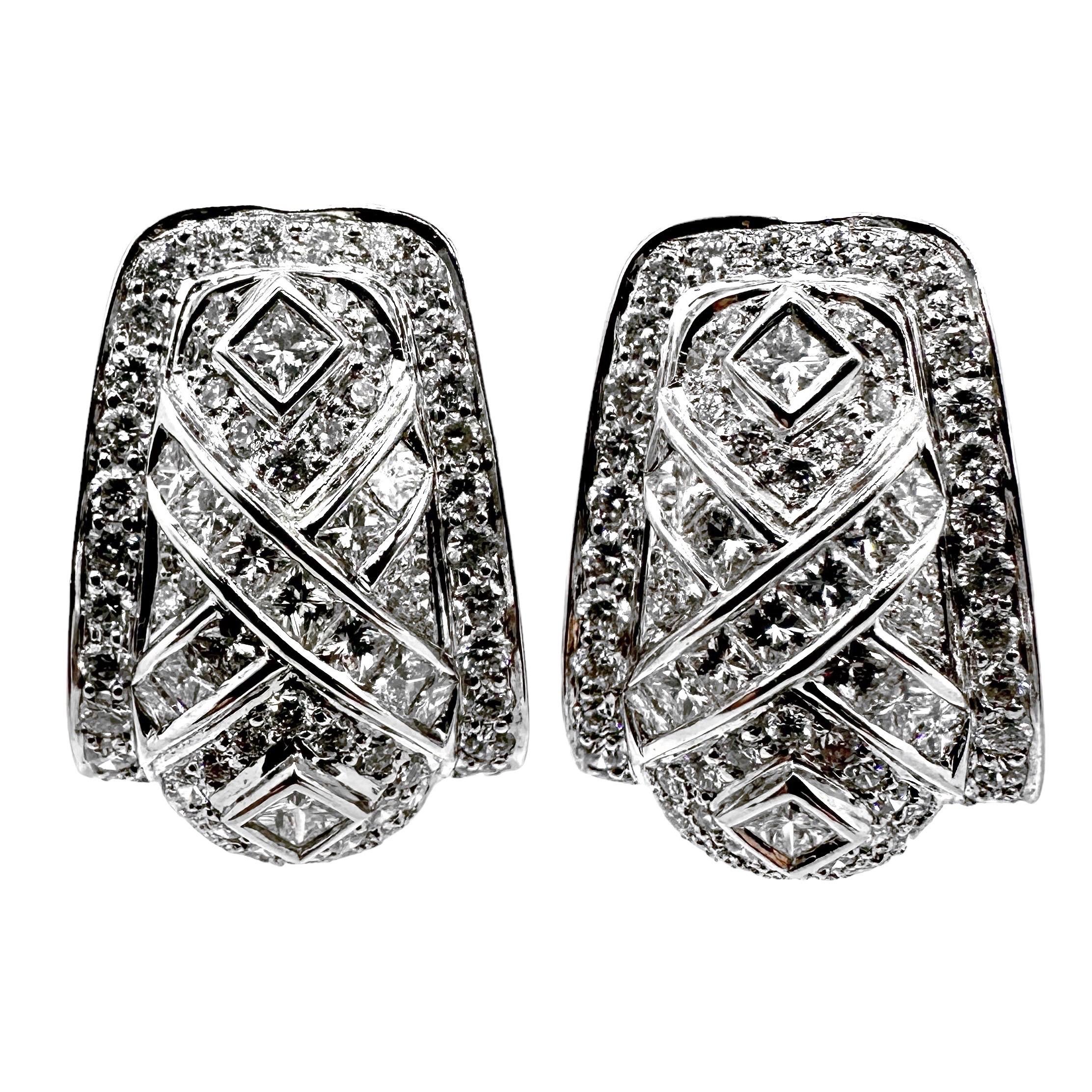 This very wearable and interesting pair of vintage 18k white gold and diamond 