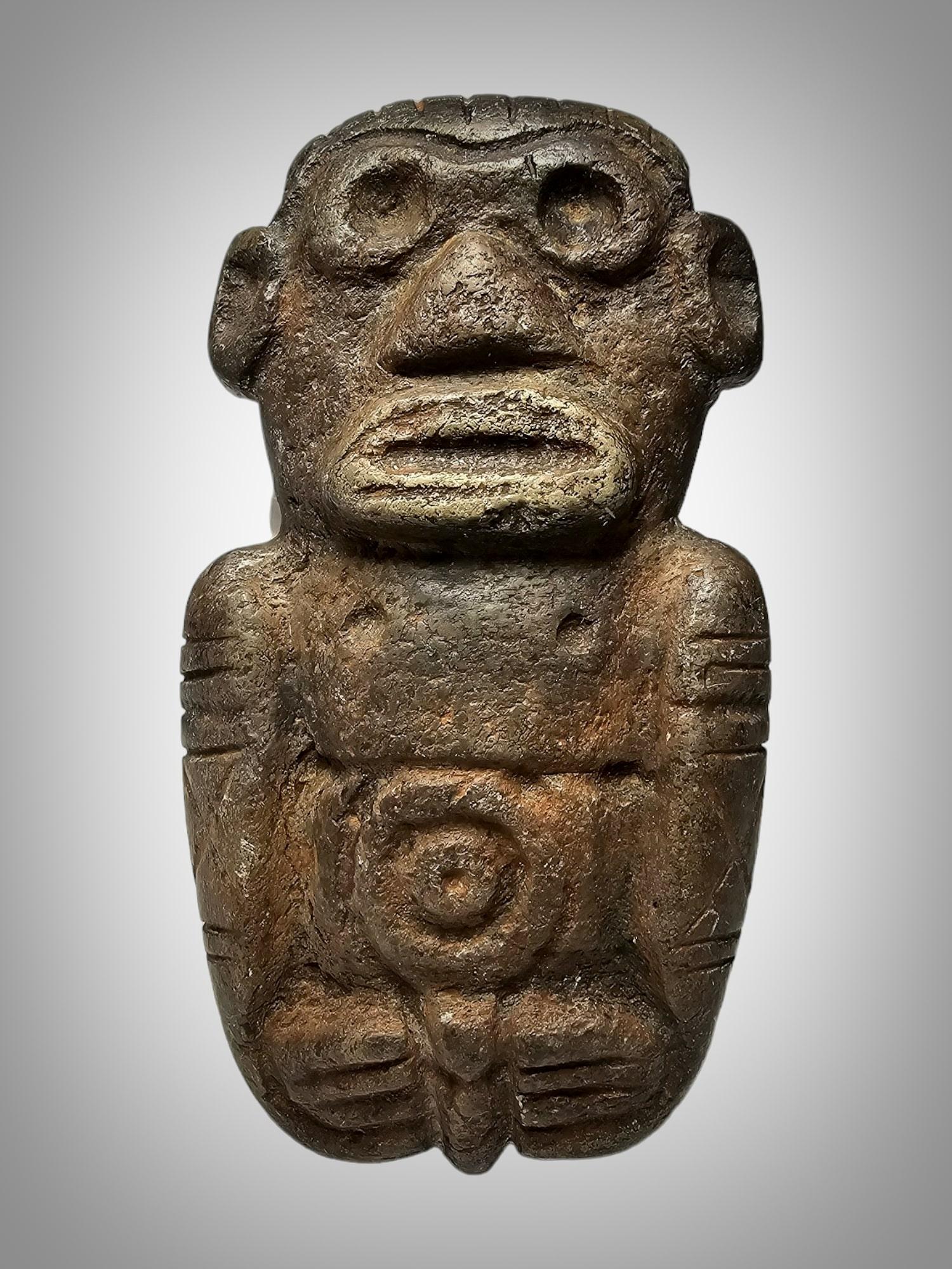 Pre-Columbian, Caribbean area, perhaps Dominican Republic, Taino (Arawak) Indians, ca. 1000 to 1500 CE. An incredibly well-preserved stone zemi of a Taino  deity  shown in a crouching position with huge eyes . Size: 12X7X2 CM

According to the
