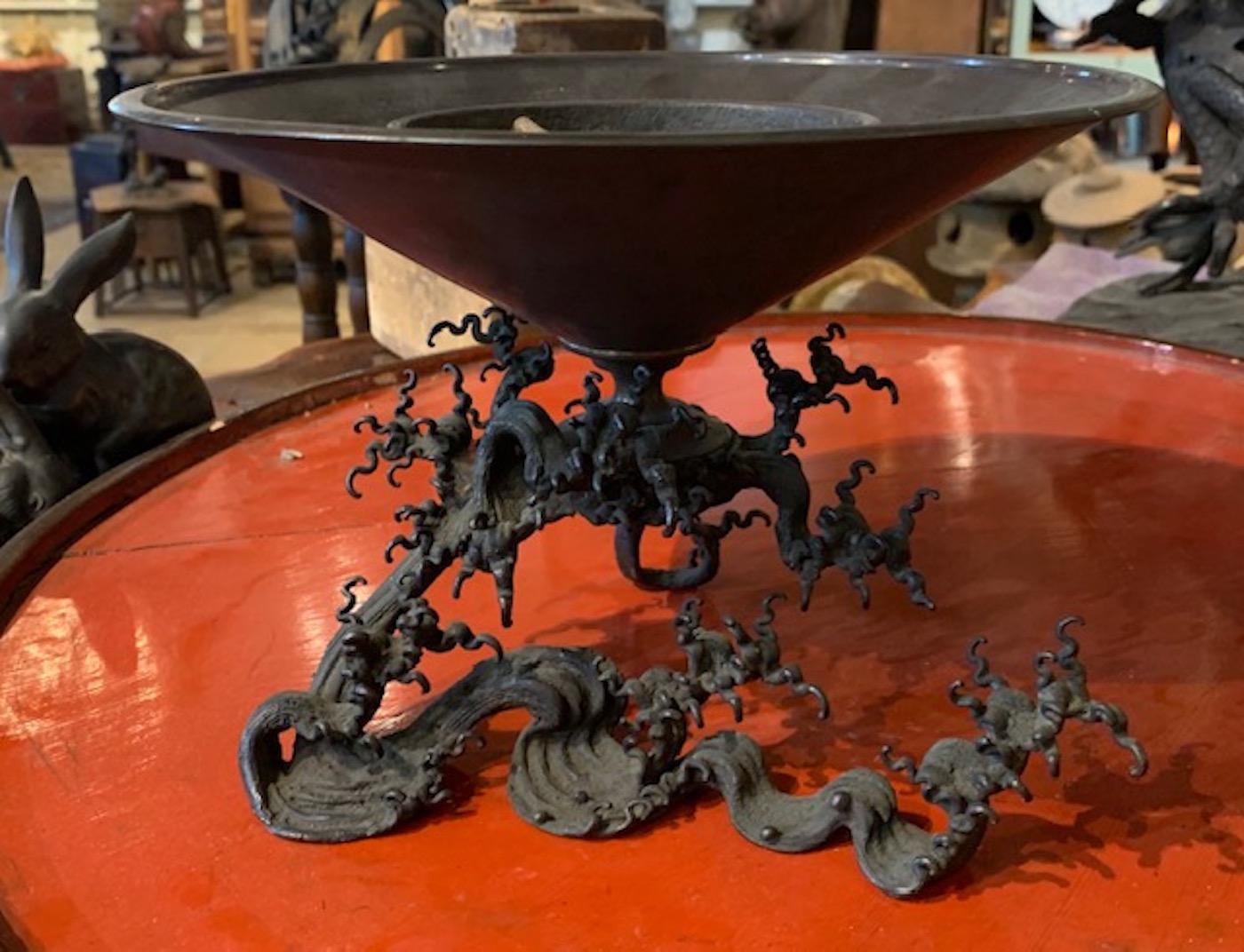 A bronze base in the form of a wave -gracefully lifts this elegant two-piece Taisho usubata. Used for ikebana flower displays, these usubata are highly regarded by the Ikenobo, the oldest and largest school of ikebana in Japan.