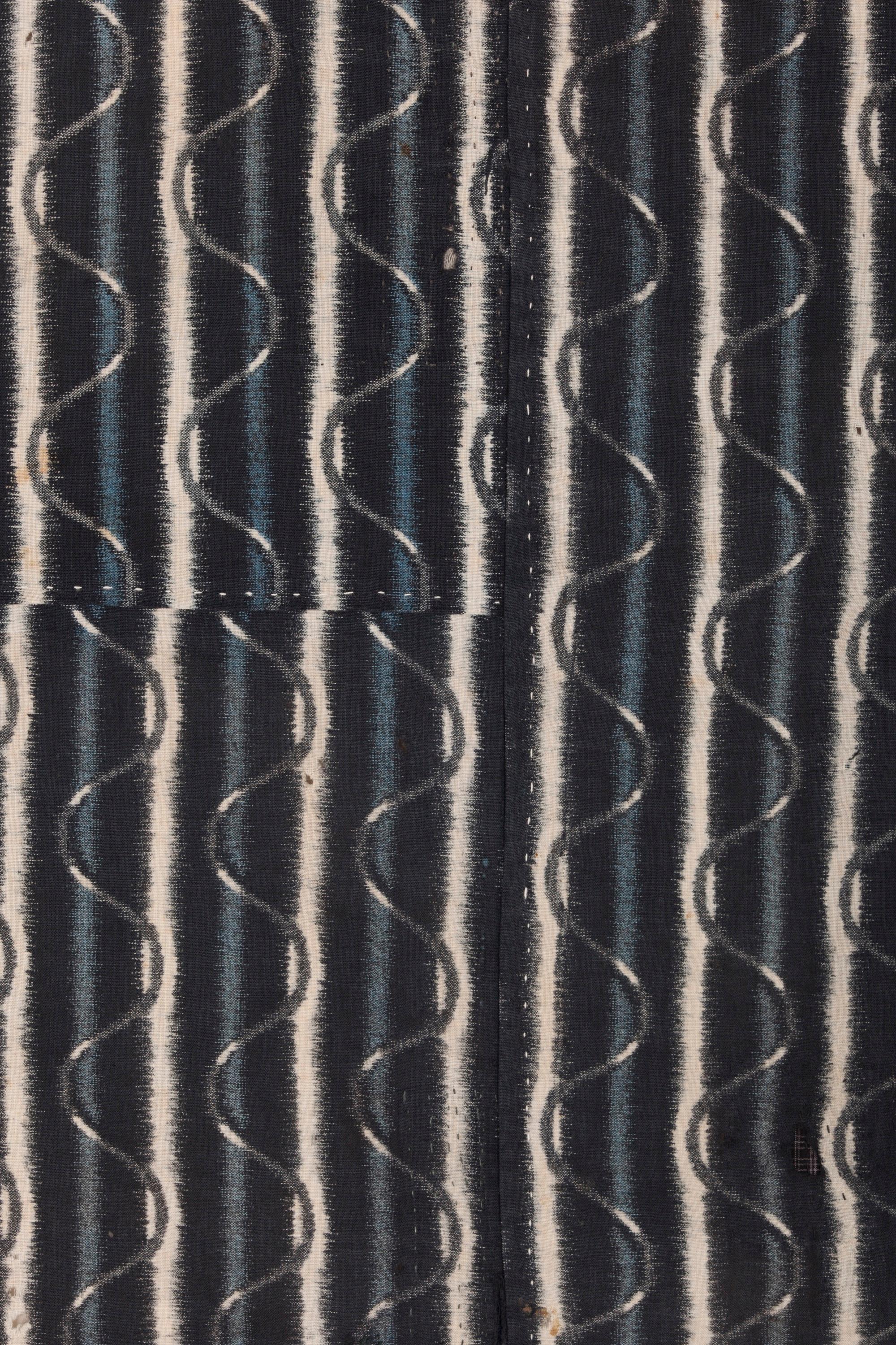 Meisen foundation fabric with wave pattern; patched with 11 varieties of kasuri (ikat); notably soft to the touch; possibly used as a furoshiki; 2 1/2 panels wide, hand constructed.