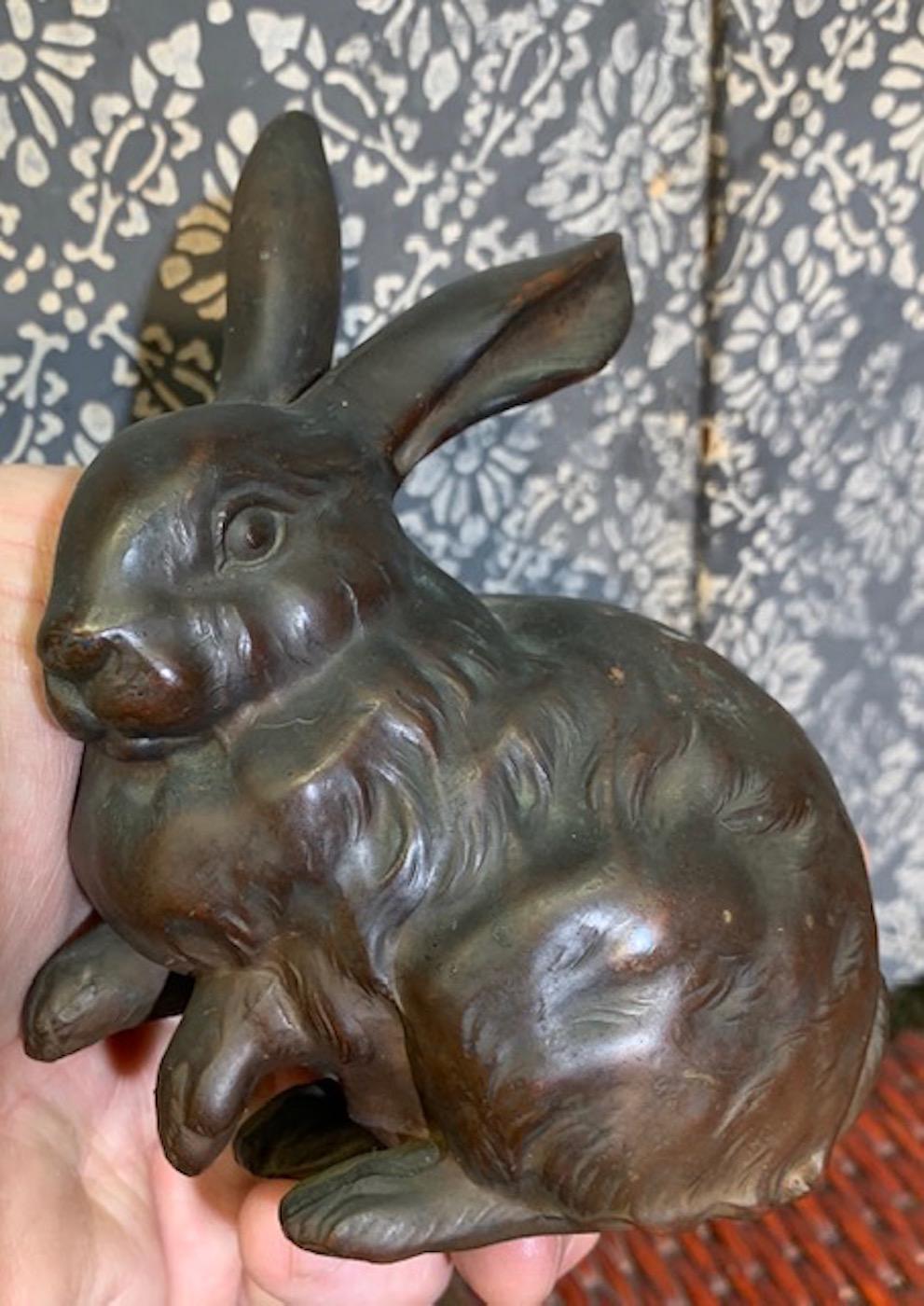 A pair of Japanese bronze rabbits dated to the Taisho Period (1912-1926). Exceptional in the details and delightfully playful in their appearance of movement.