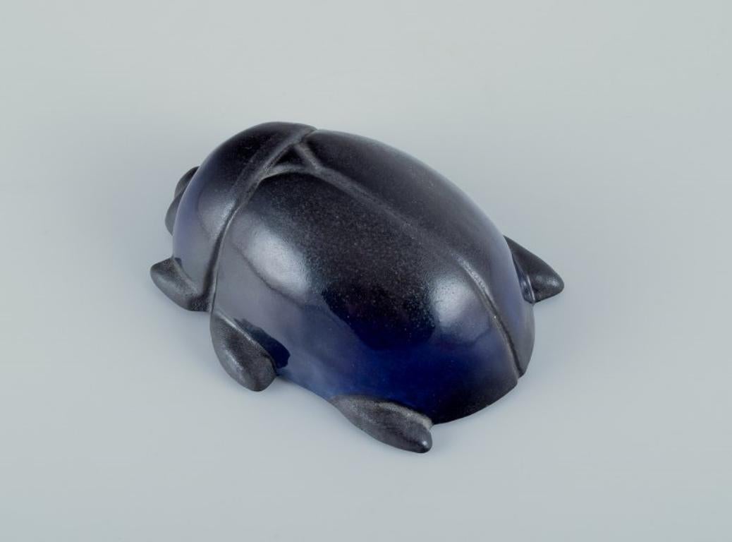 Finnish Taisto Kaasinen for Arabia, Finland. Rare ceramic scarab in blue and black glaze