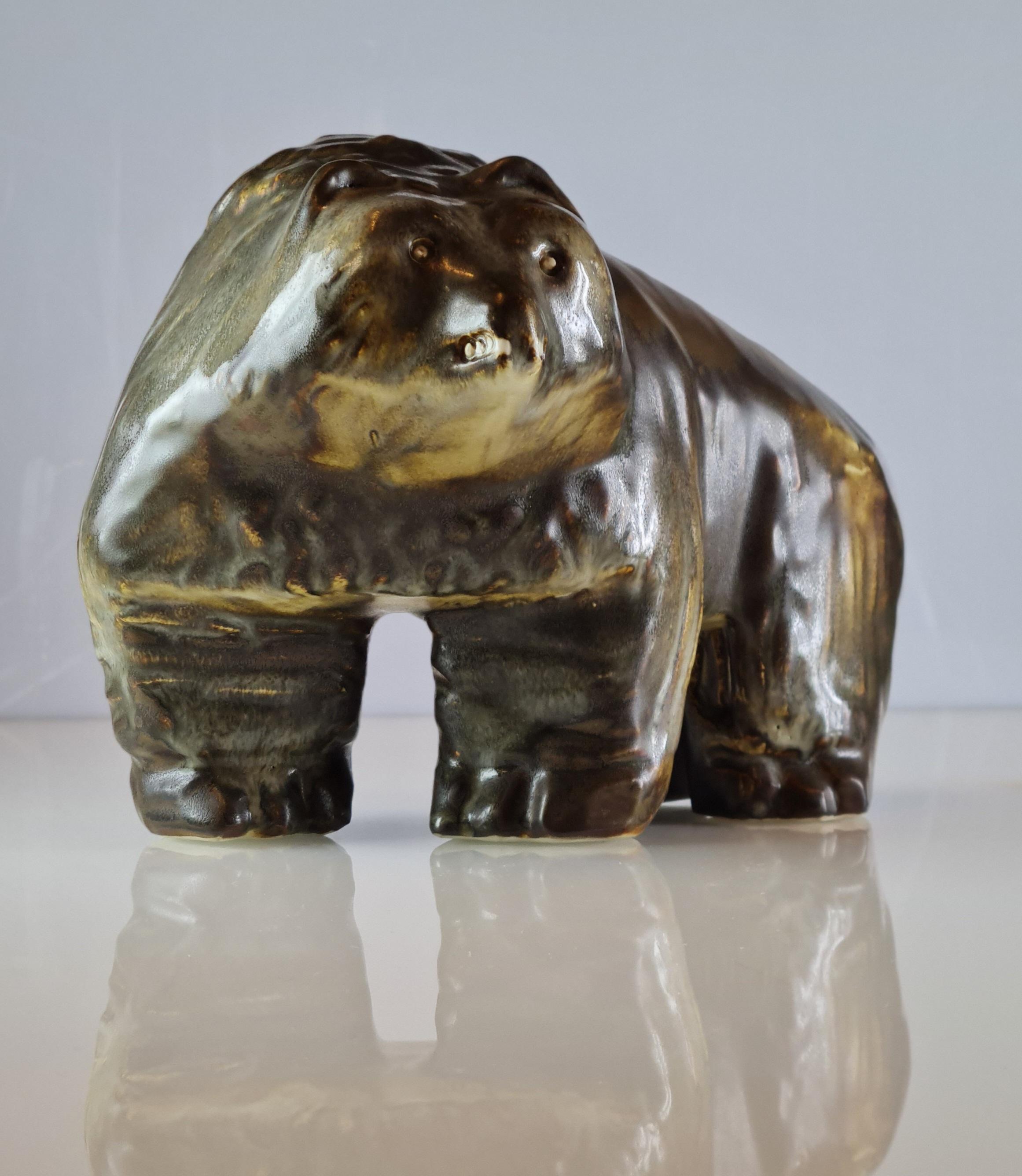 A beautiful and fairly large ceramic bear figurine by the renowned Finnish ceramic artist and designer Taisto Kaasinen for Arabia. The figurine is signed TK and Arabia and is in beautiful condition.

Not only a collector's item for ceramic or