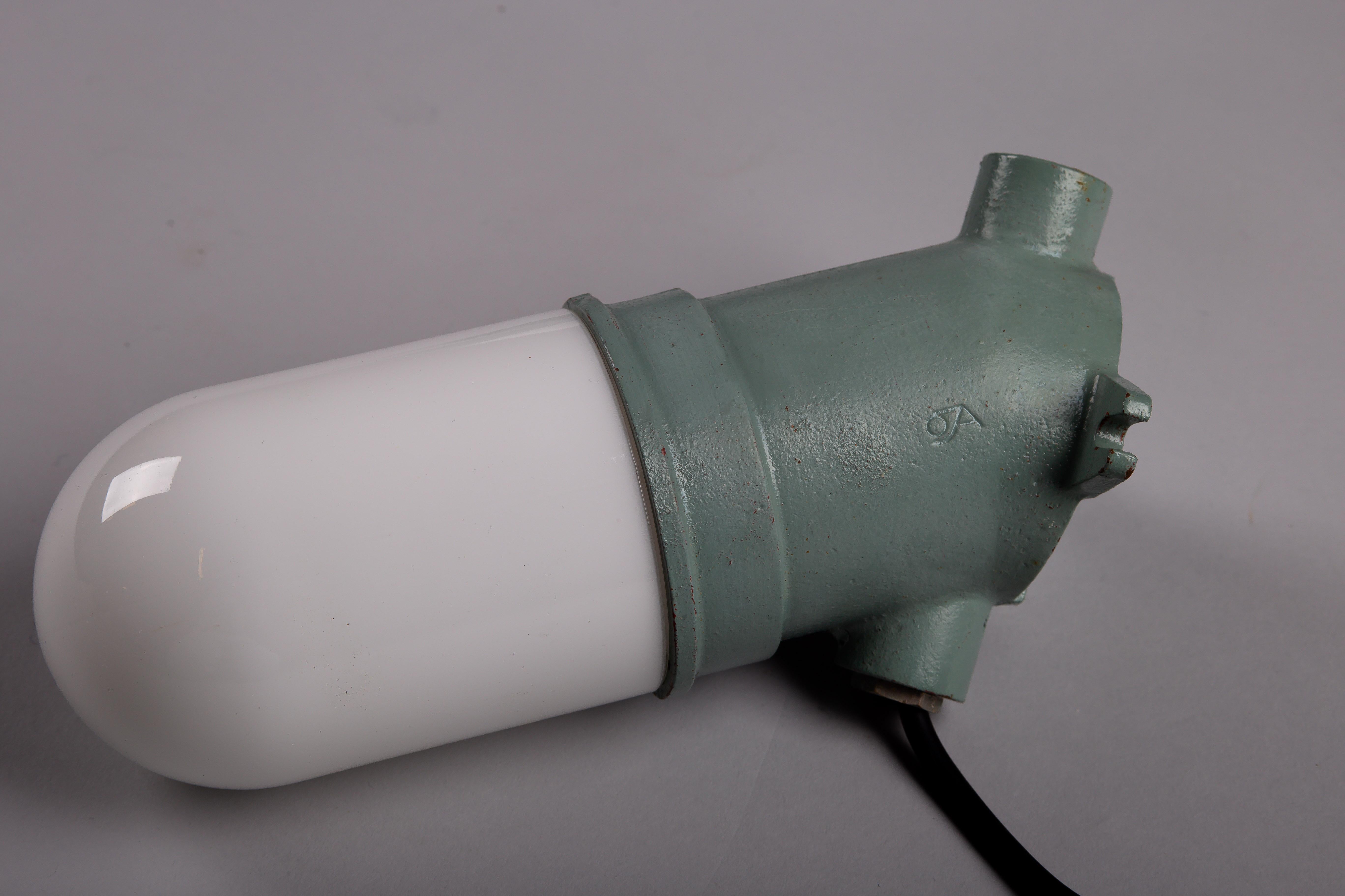 Cast Taito Oy, set of three green 1930's cast iron industrial wall lamps