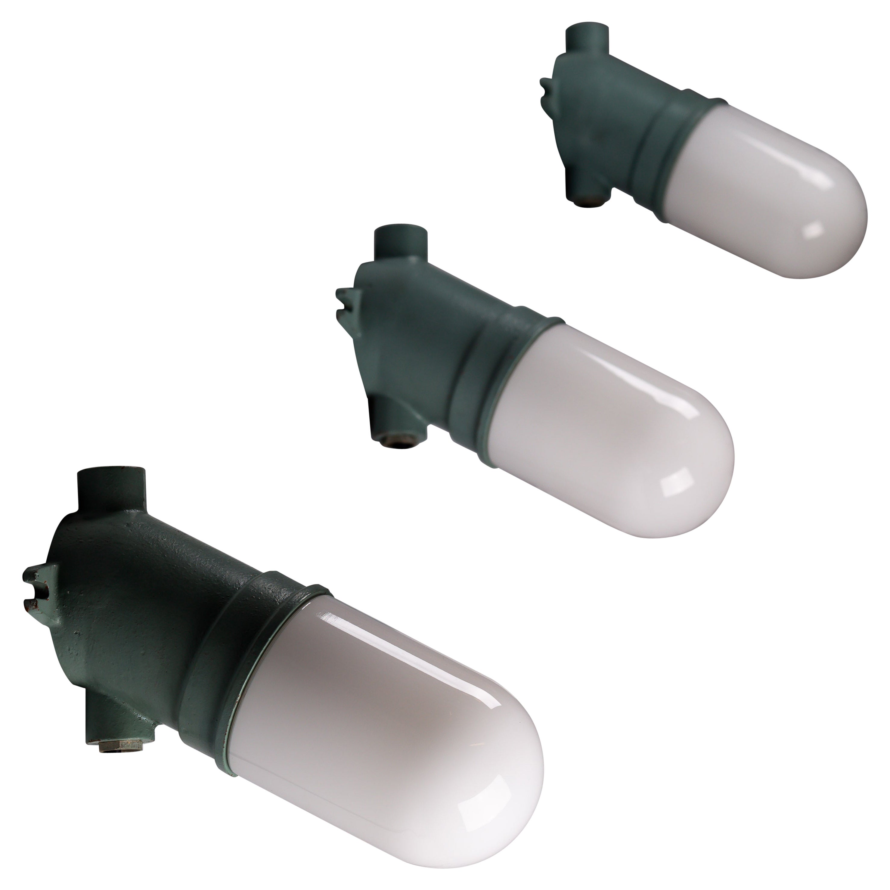 Taito Oy, set of three green 1930's cast iron industrial wall lamps