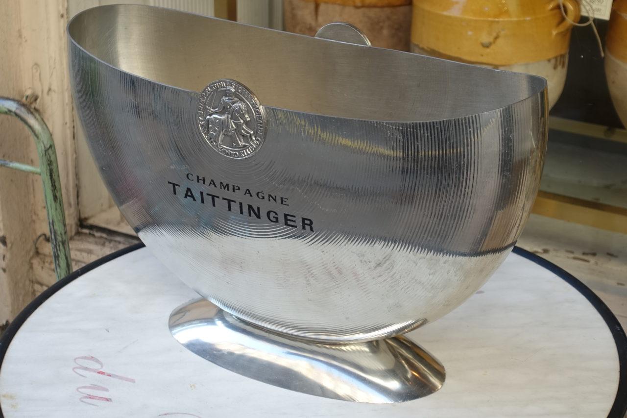 Elegant and refined semi circular champagne / wine ice bucket, from Taittinger. This gorgeous double cooler can hold 2 magnums. Made of highly polished tin, and OA stamped on the base, referring to the renowned metal producer l’Orfèvrerie d’Anjou.