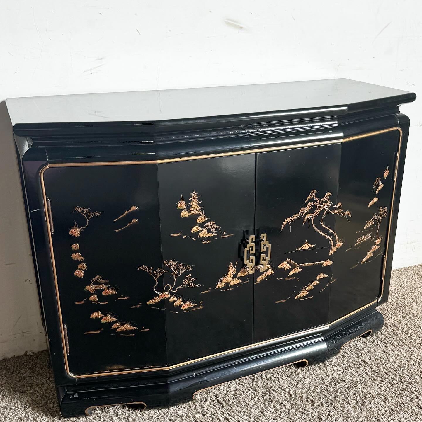 Discover the elegance of Taiwanese craftsmanship with the Black Lacquered and Gold Hand Painted Credenza/Sideboard. Merging rich black lacquer with luxurious gold details, this piece showcases traditional Taiwanese motifs, adding sophistication and