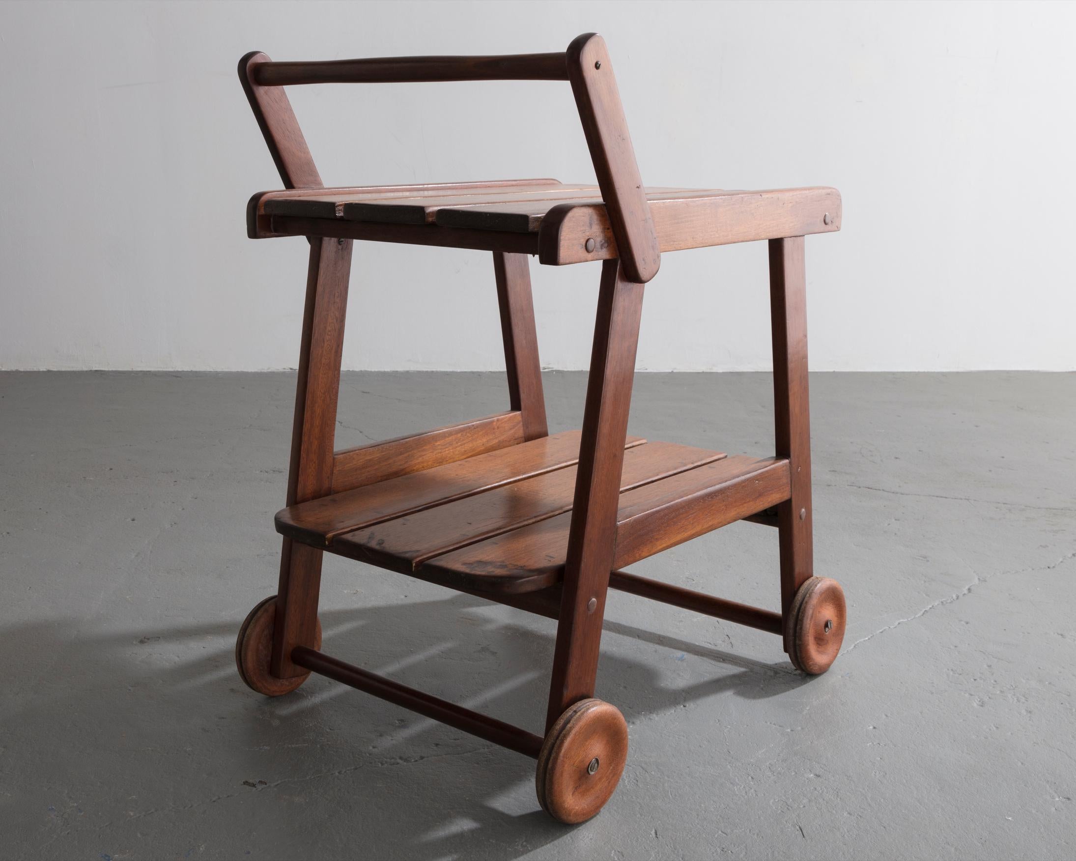 Tajá tea cart in solid rose wood designed by Sergio Rodrigues, Brazil, circa 1978.