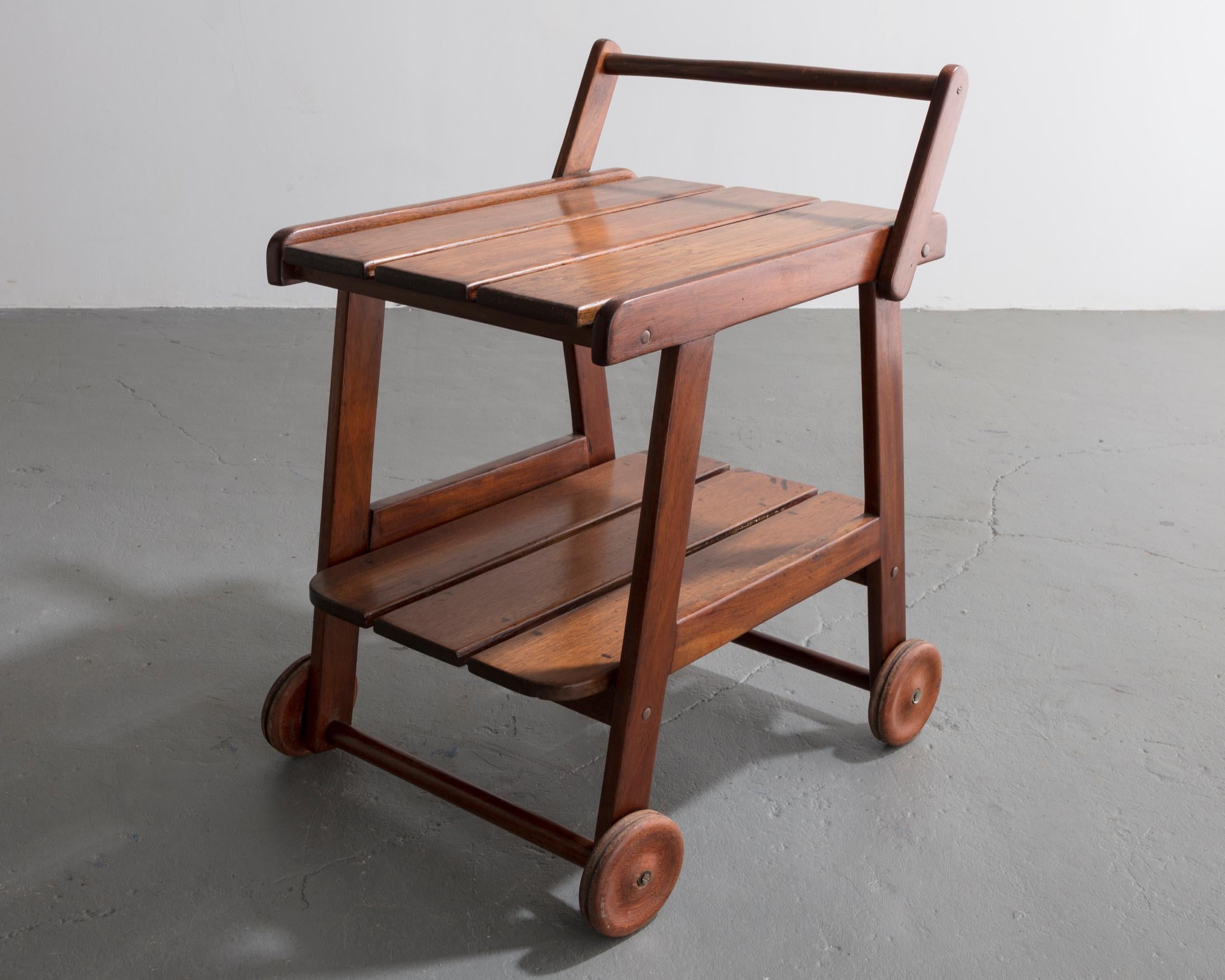 Tajá tea cart in solid rose wood designed by Sergio Rodrigues, Brazil, circa 1978.
 