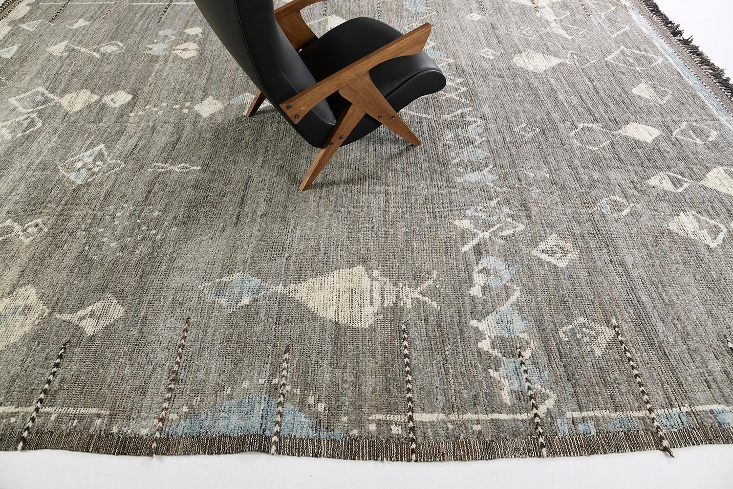 Tajeddigt is gorgeous wool that uses linework and ambiguous Berber symbols that telling of the narrative. Gray and blue tones are added to strengthen the creativeness of the designer. Mehraban's Atlas collection is noted for its saturated color,