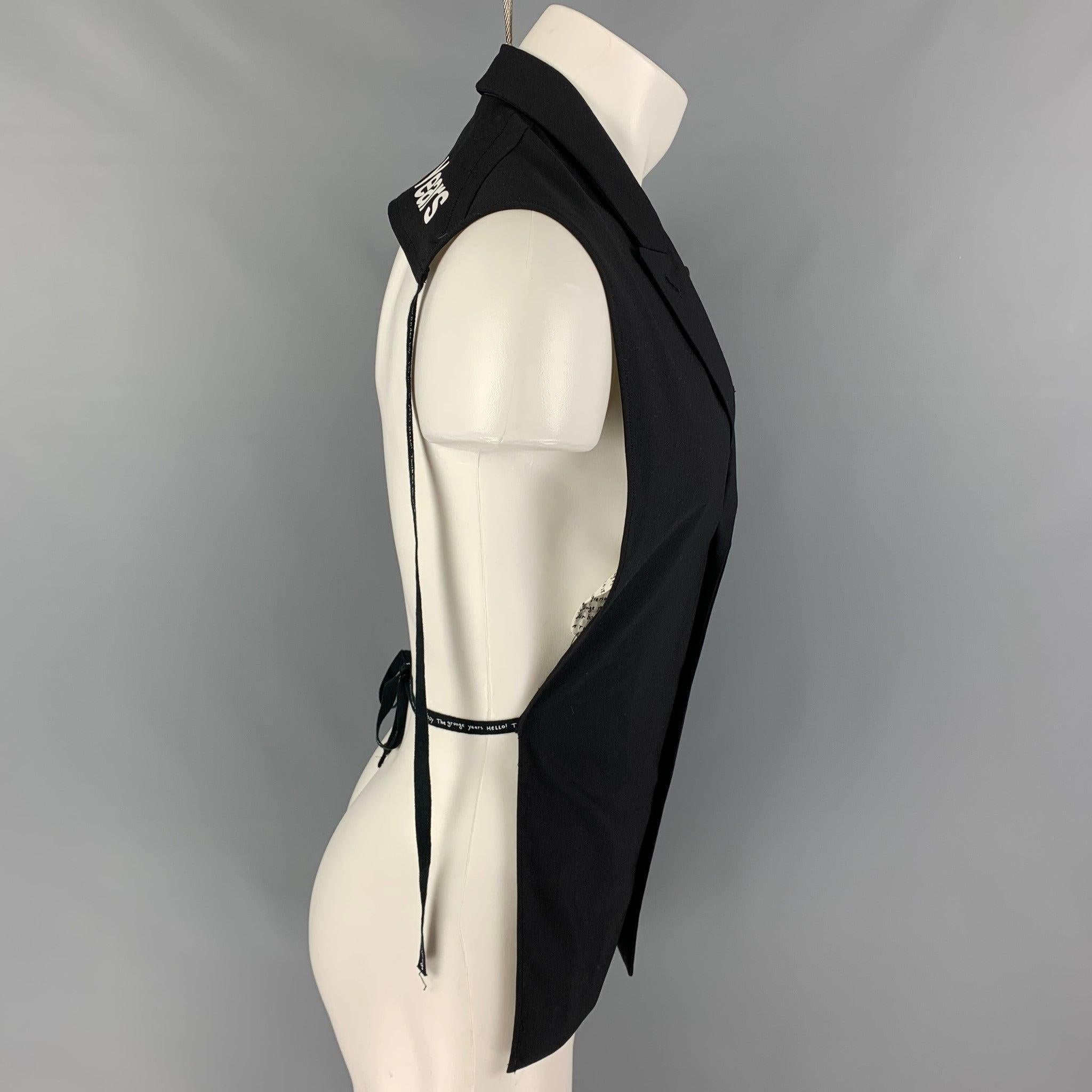 TAKAHIROMOIYASHITA vest comes in a black cotton featuring a open back, peak lapel, back self-tie straps, white 