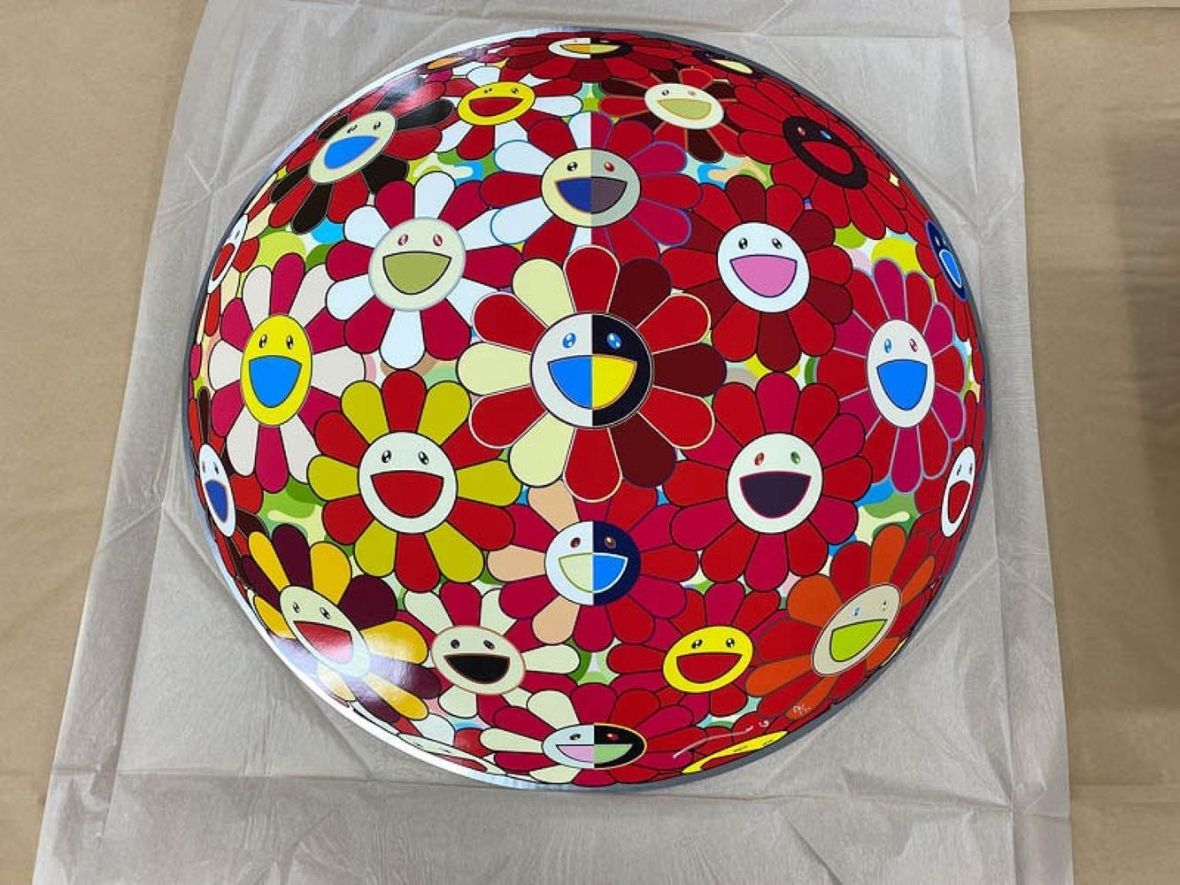 Flower Ball (3-D) Magic Flute, 2011 by Takashi Murakami
Woven paper, four-color offset print, cold foil stamp, glossy varnish
Published by Kaikai Kiki Co., Ltd., Tokyo
28 in diameter
71 cm diameter
Edition 54/300

Takashi Murakami is best known for