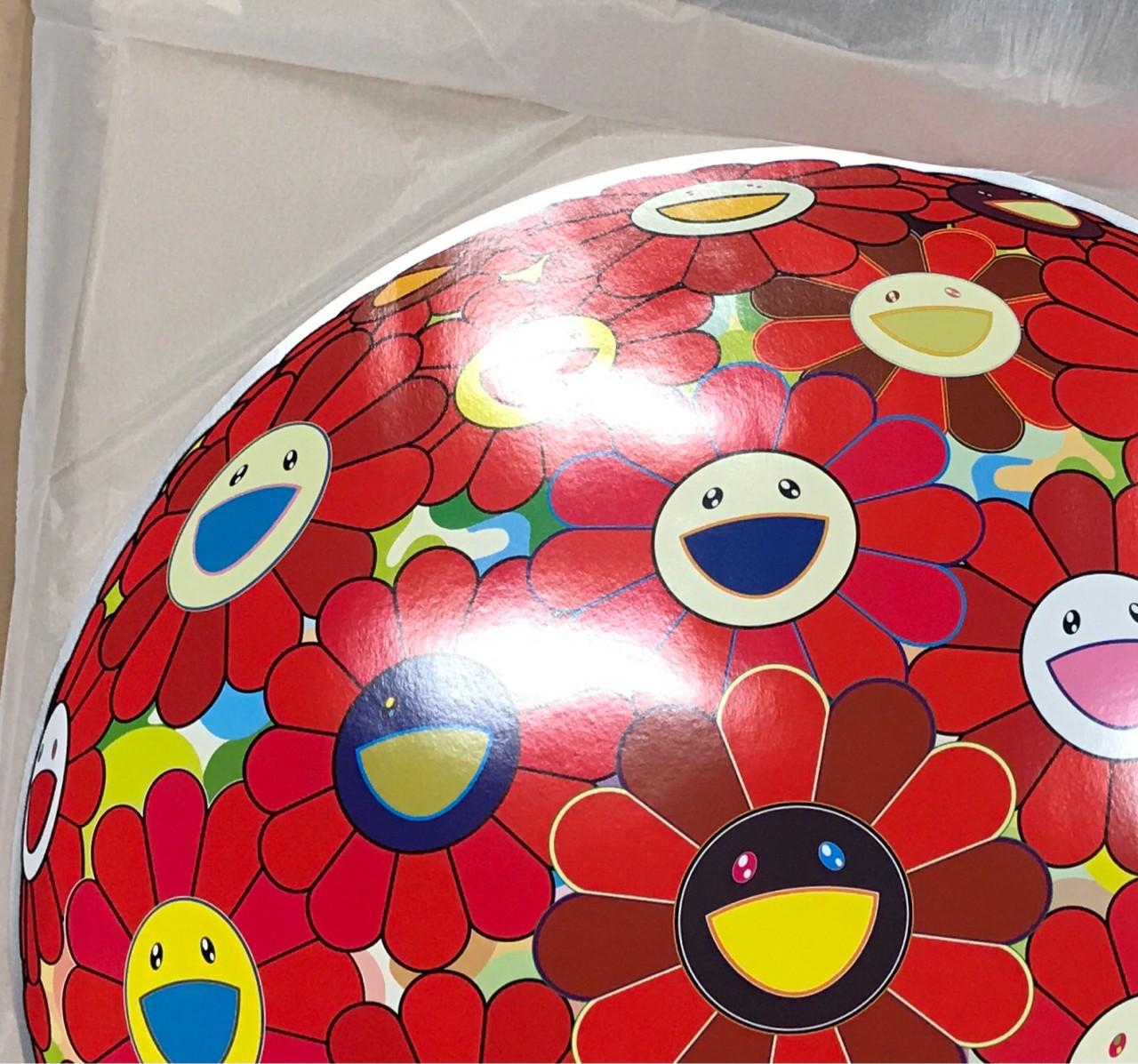 Red Flowerball (3D), 2013 by Takashi Murakami
Woven paper, four-color offset print, cold foil stamp, glossy varnish
Published by Kaikai Kiki Co., Ltd., Tokyo
28 in diameter
71 cm diameter
Edition 134/300

Takashi Murakami is best known for his