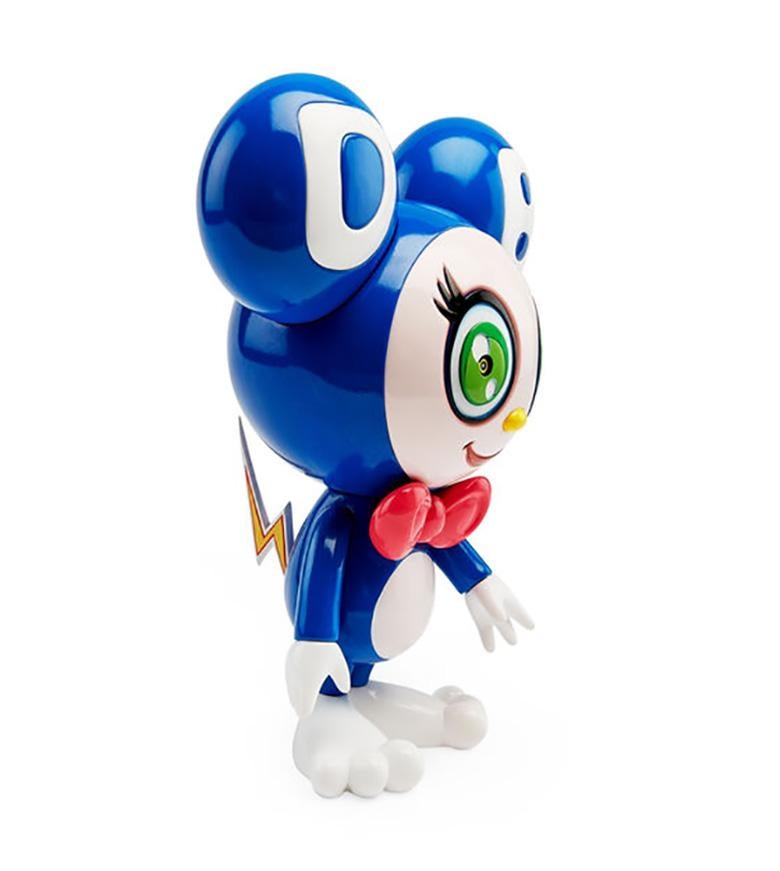 Takashi Murakami DOB-kun Figure 2019:
DOB-kun’s name, defined in his rounded ears and face, is the first three letters of an improvised phrase that is a nonsensical combination of “dobojide dobojide (why, why?)” from the Japanese manga series