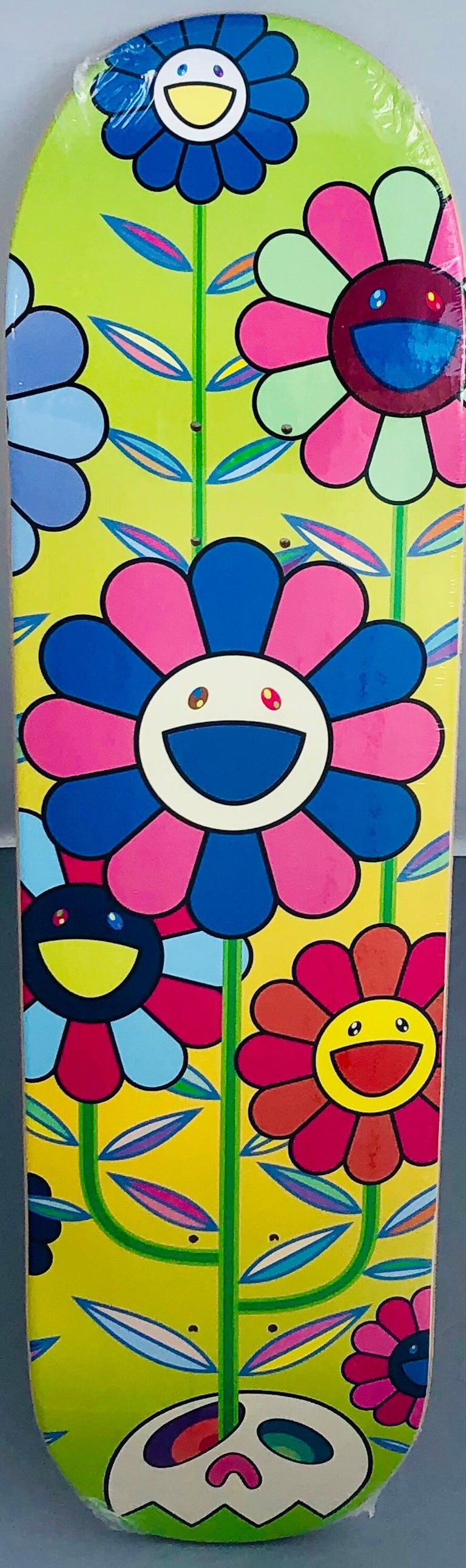 Takashi Murakami Flowers Skate Deck:
A vibrant piece of Takashi Murakami wall art produced as a completely sold out, limited series in 2019 in conjunction with Complexcon and Kaikai Kiki co. This deck is new in its original packaging. A brilliant