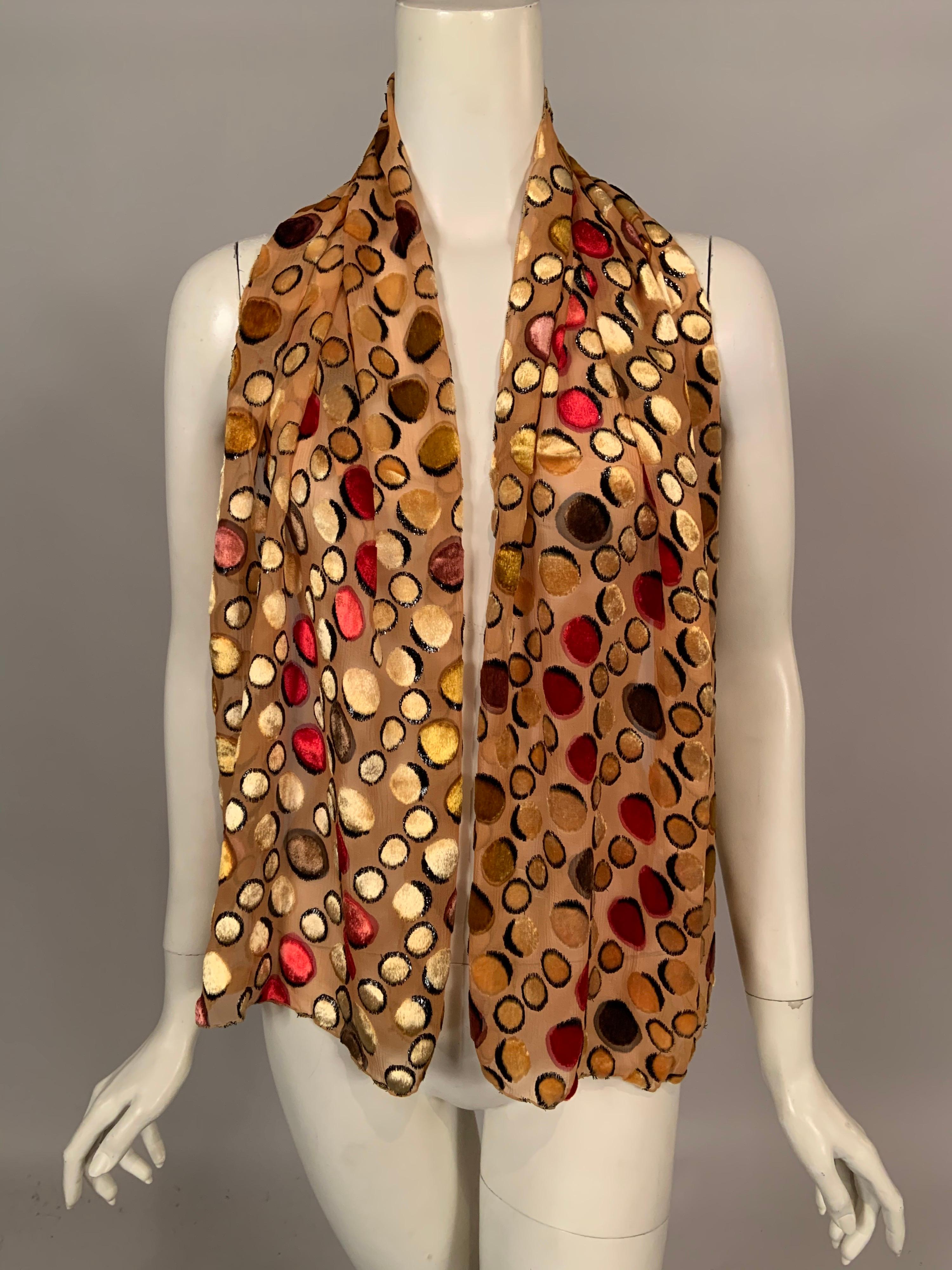 Gold silk georgette is covered with velvet dots or circles of varying sizes in yellow, rose, gold red and brown with black highlights. The shawl is both elegant and whimsical and it is in excellent condition.
Measurements;
Length 58