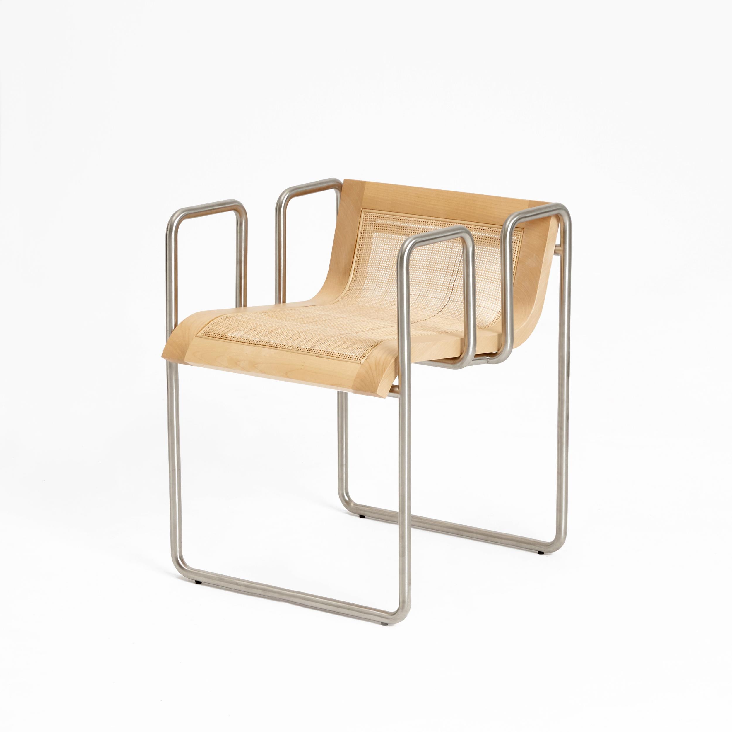 Take a seat in natural by Project 213A
Dimensions: D 53 x W 48.5 x H 61.5 cm
Materials: Wood, metal.

The metal loops converge elegantly into the middle with the frame embracing the wooden seat.
The seat features an elegant metal frame engineered to
