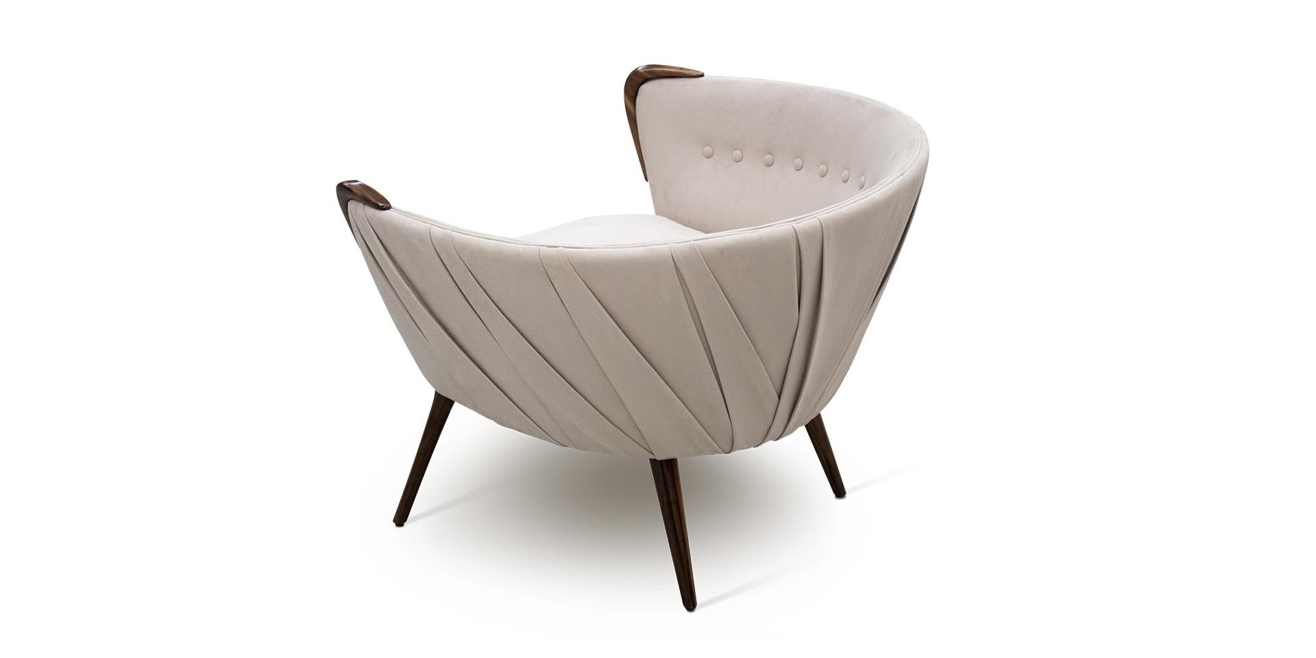 Takeami armchair is full of details on its back side. The contemporary piece will add personality to the living room. Interior designers use this piece in contemporary decorations.
