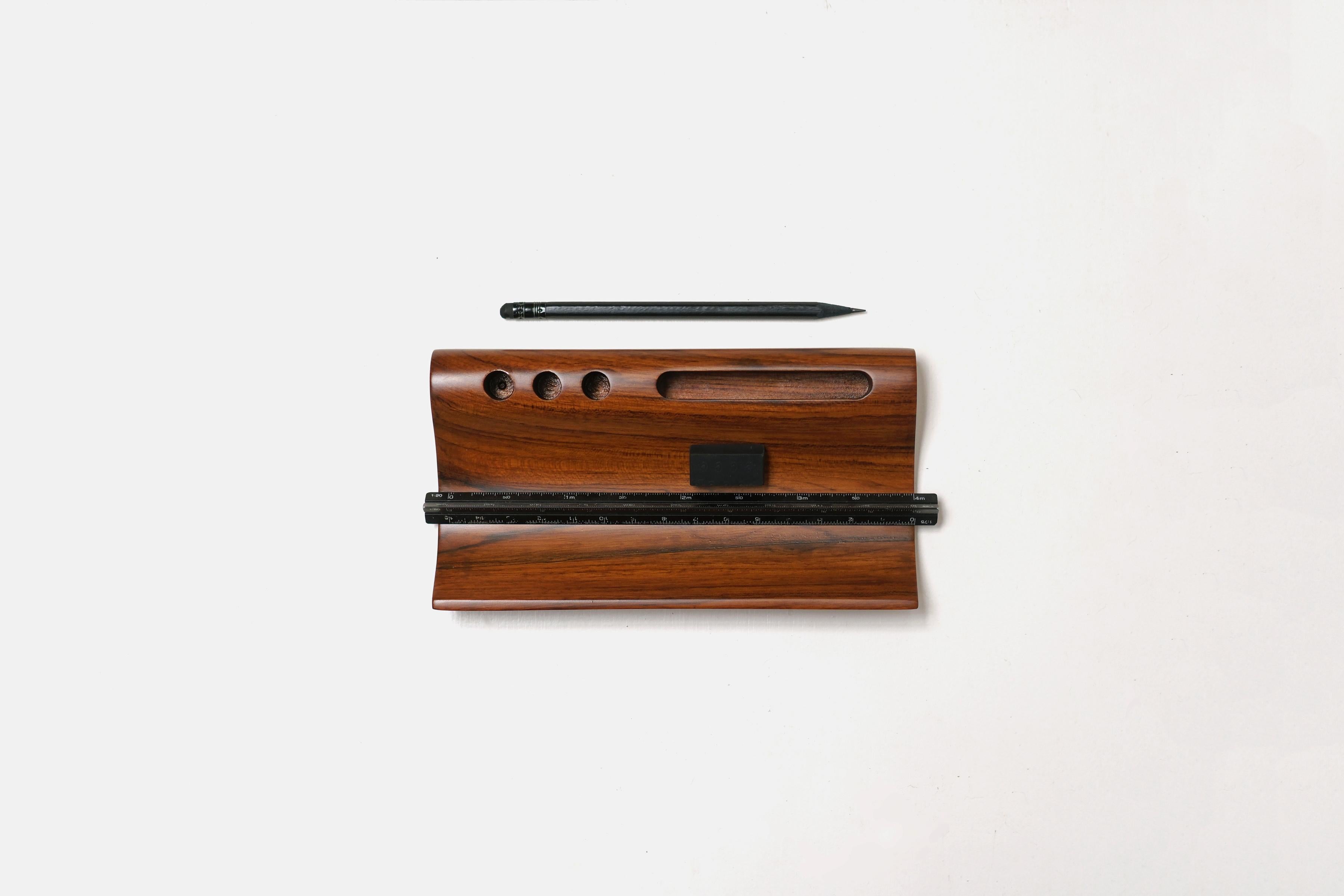 Taksh Stationery Holder by Studio Indigene
Dimensions: D 20.32 x W 11.43 x H 3.71 cm
Materials: Reclaimed Teak Wood.
Colors Brown, Natural Wooden Finish.

The Taksh Stationery Holder neatly organizes pens and stationery for a tasteful desk