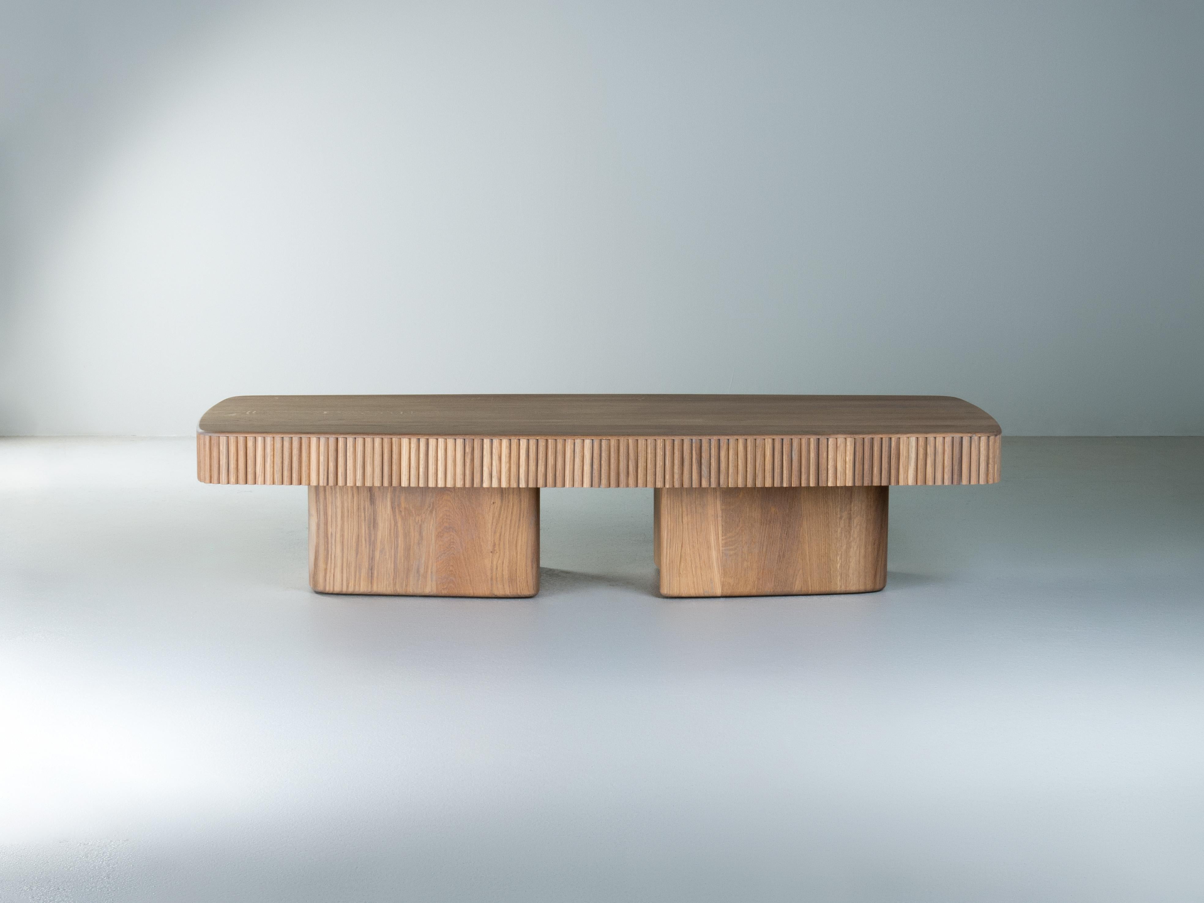This table differs from the other coffee tables from our portfolio primarily due to its compact volume and slightly lower height (30 cm) than standard coffee tables. This provides it with a complementary sense of fullness and monolithicity.  The