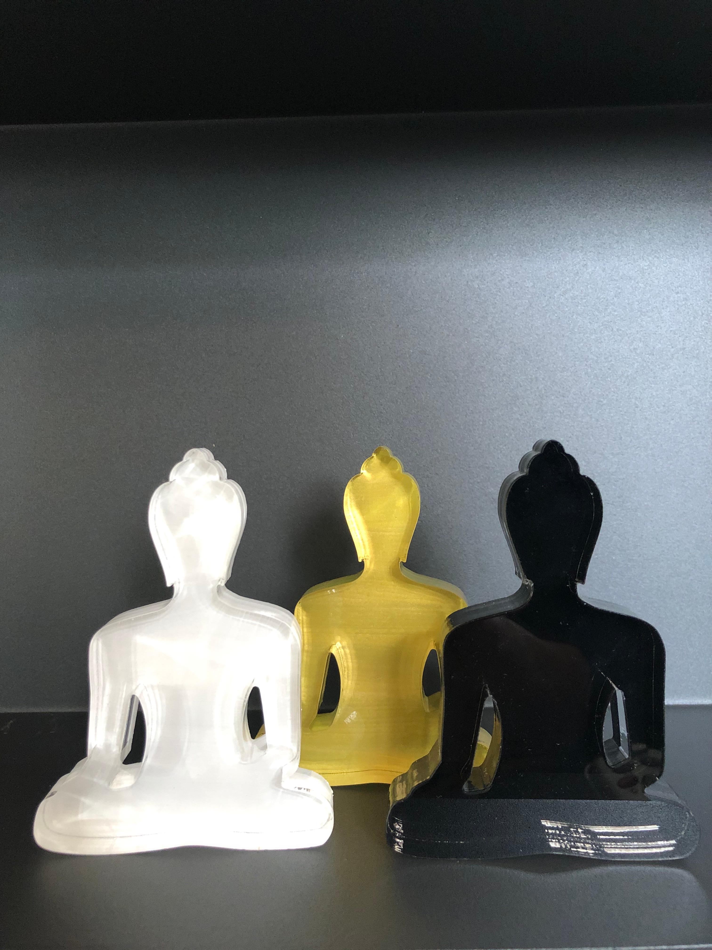 The mini Buddha statues were created by the artist as an everyday reminder to live a compassionate and mindful life. 
The statues are a contemporary design, made of Plexiglas, and hand-painted with love. 
They will add a touch of style and