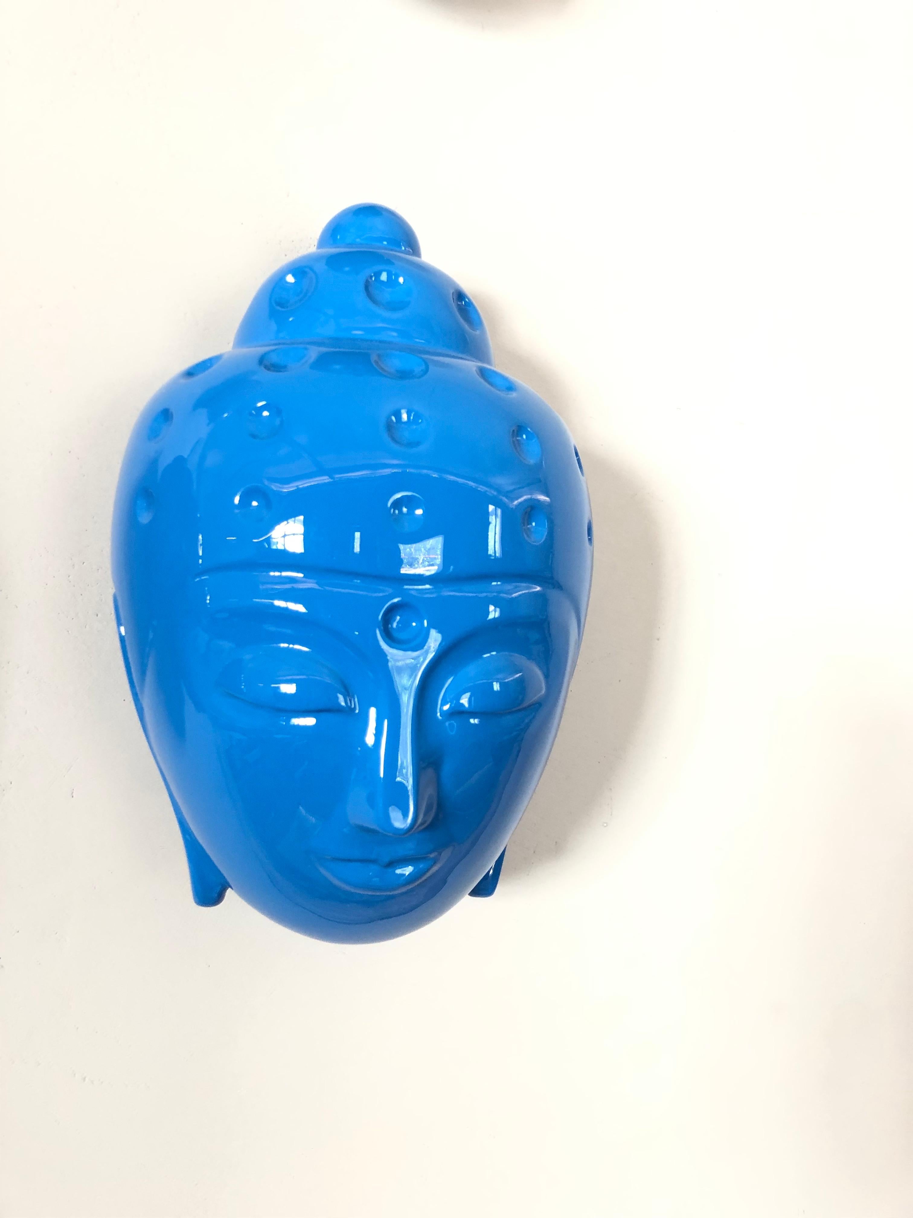 blue buddha head statue