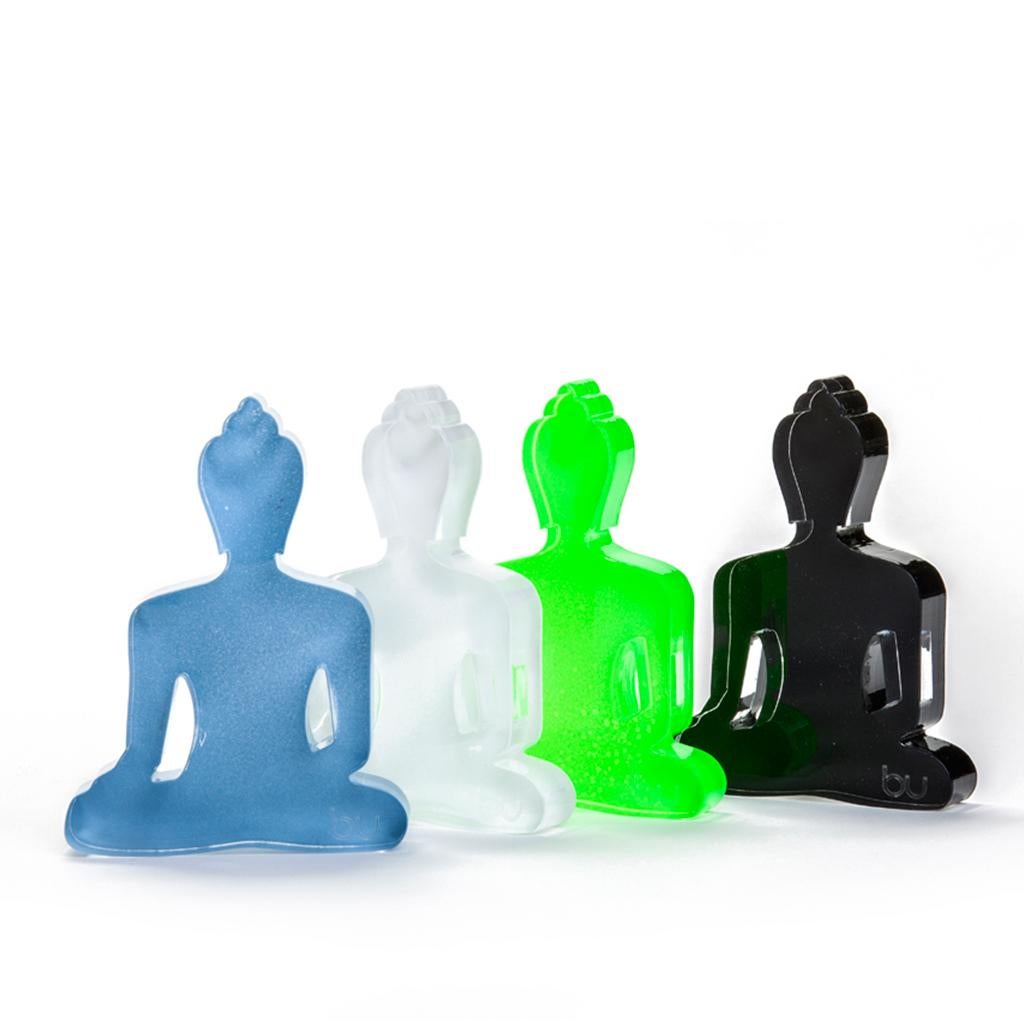 The mini Buddha statues are designed as an everyday reminder to live a compassionate and mindful life. 
The statues are a contemporary design, made of Plexiglas, and hand painted with love. 
The statues come in different colors and will add a touch