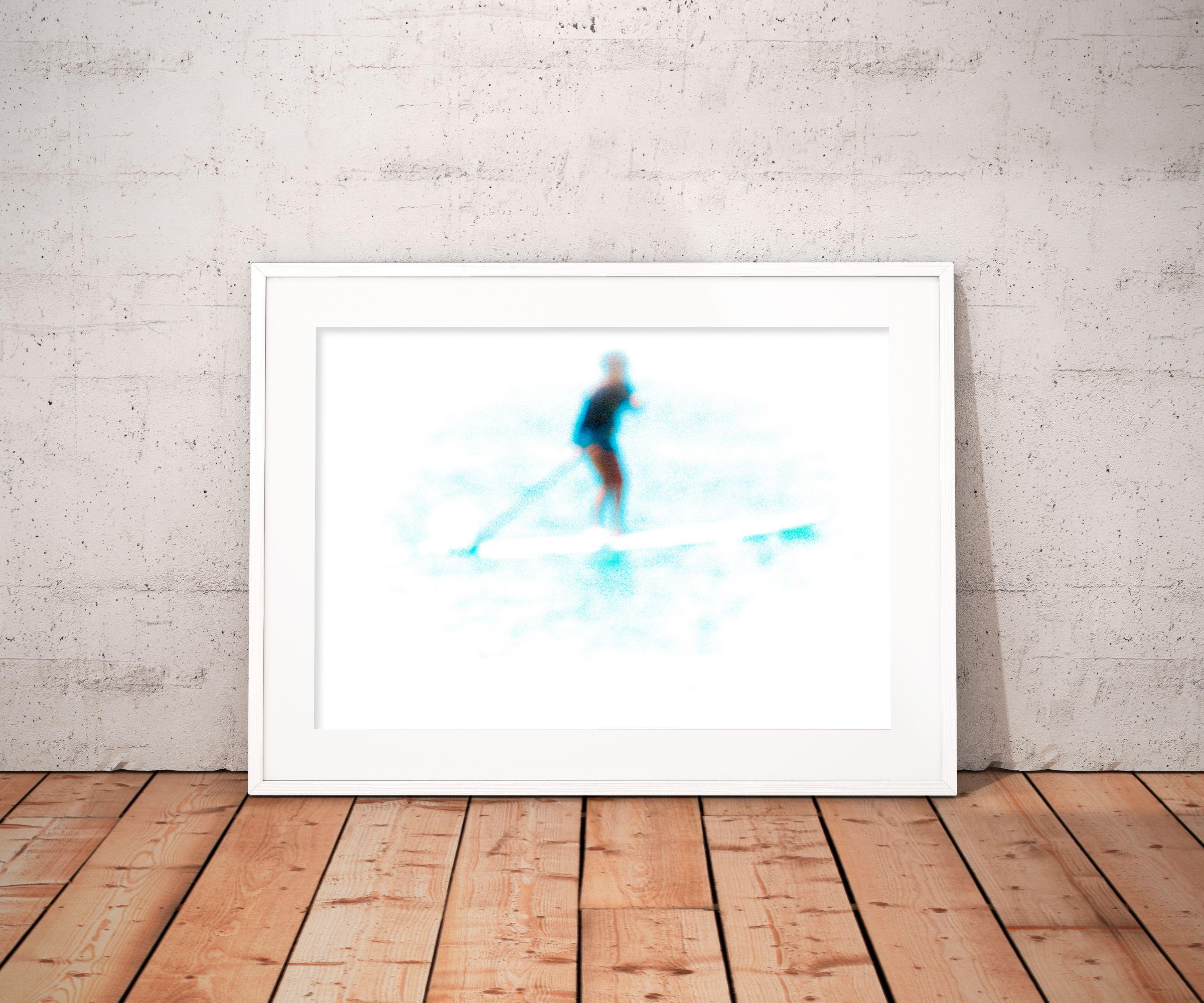 An out of focus subject stands atop a stand up paddle adjacent to the Sdot Yam beach. The subject's lack of recognizable features diminish their prevalence in the scene, as they appear to dissolve into the white background.    *****    Limited
