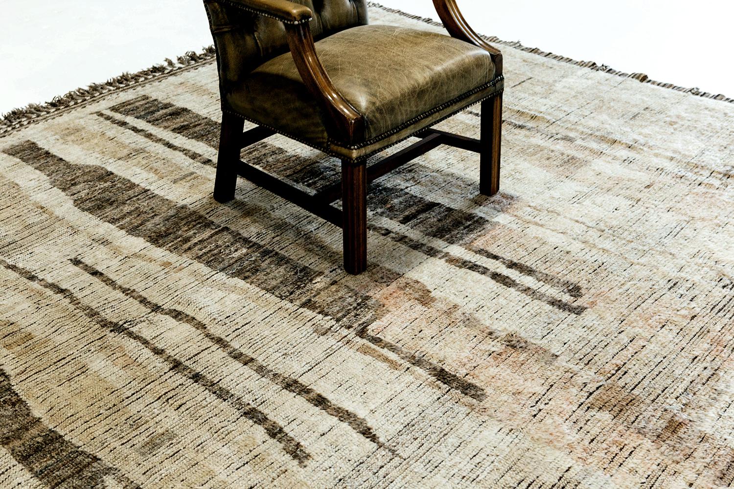 Talassemtane' is a beautifully textured rug with irregular motifs inspired from the Atlas Mountains of Morocco. Black and sepia tan surrounded by the perfect white shag work cohesively to make for a great contemporary interpretation for the modern