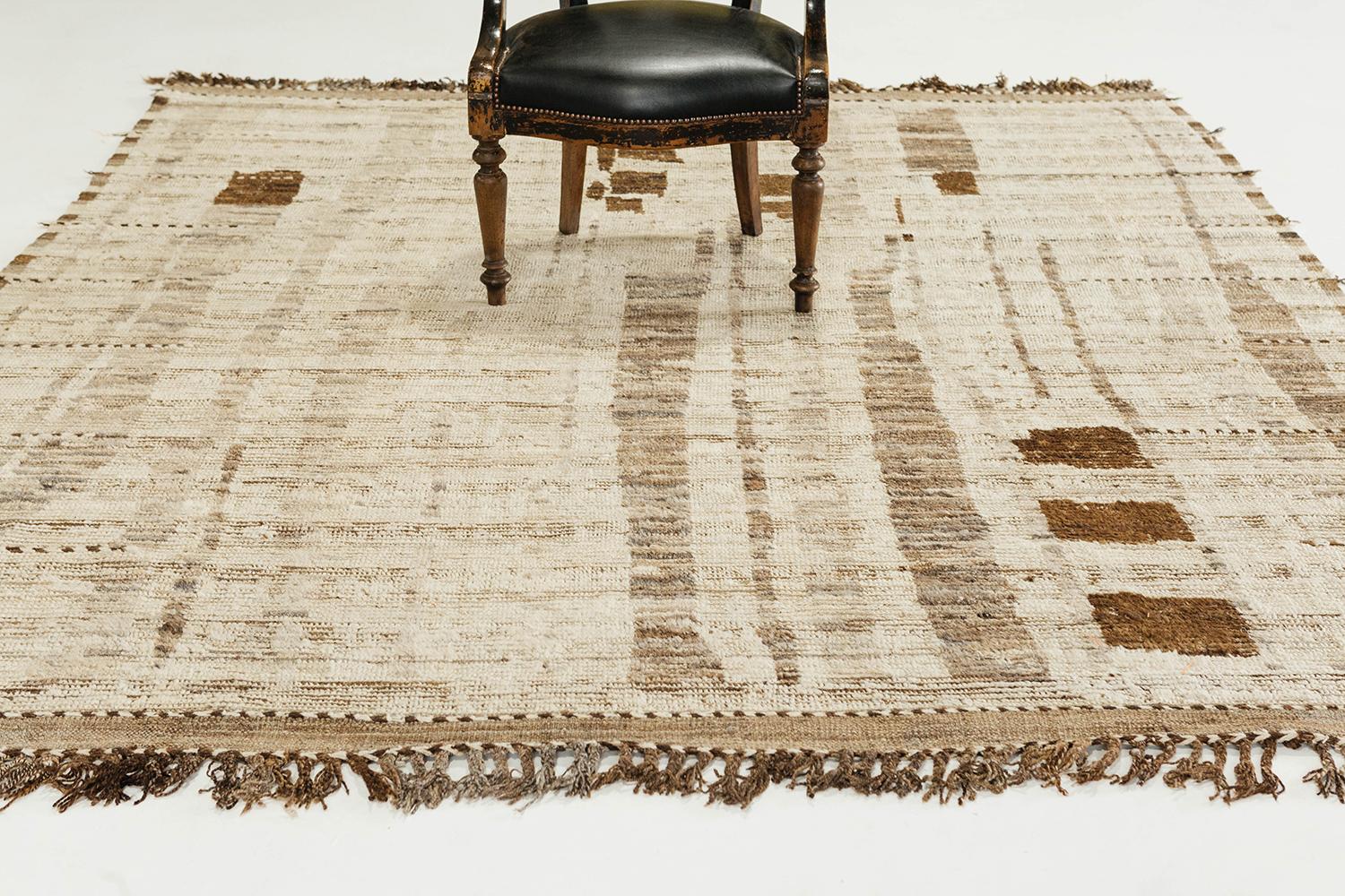 'Talassemtane' is a beautifully textured rug with irregular motifs inspired from the Atlas Mountains of Morocco. The neutral colors work cohesively to make for a great contemporary interpretation for the modern design world. Mehraban's Atlas