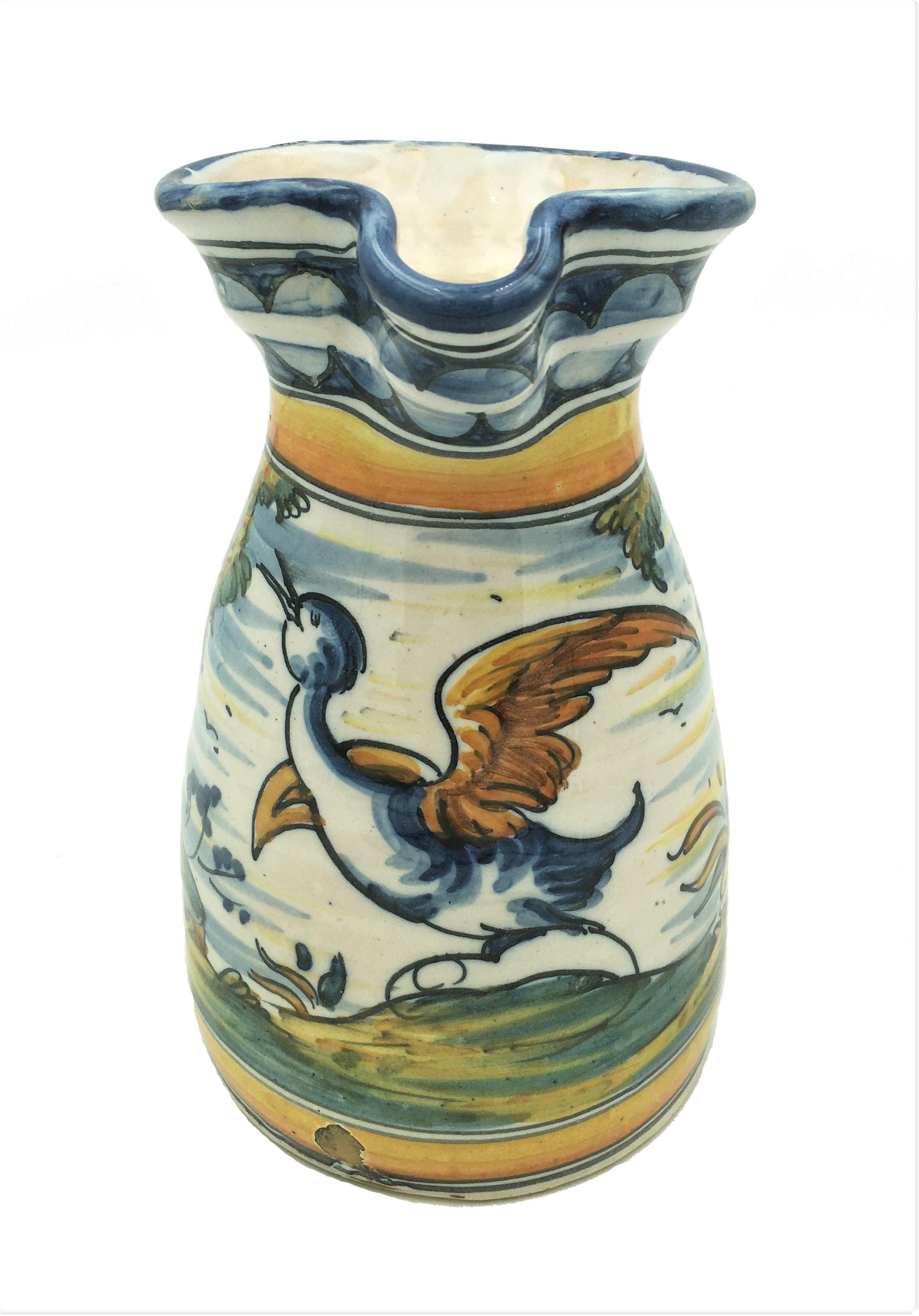 Spanish Talavera de la Reina hand painted ceramic wine pitcher with bird and trees polychrome decoration, early 20th century.