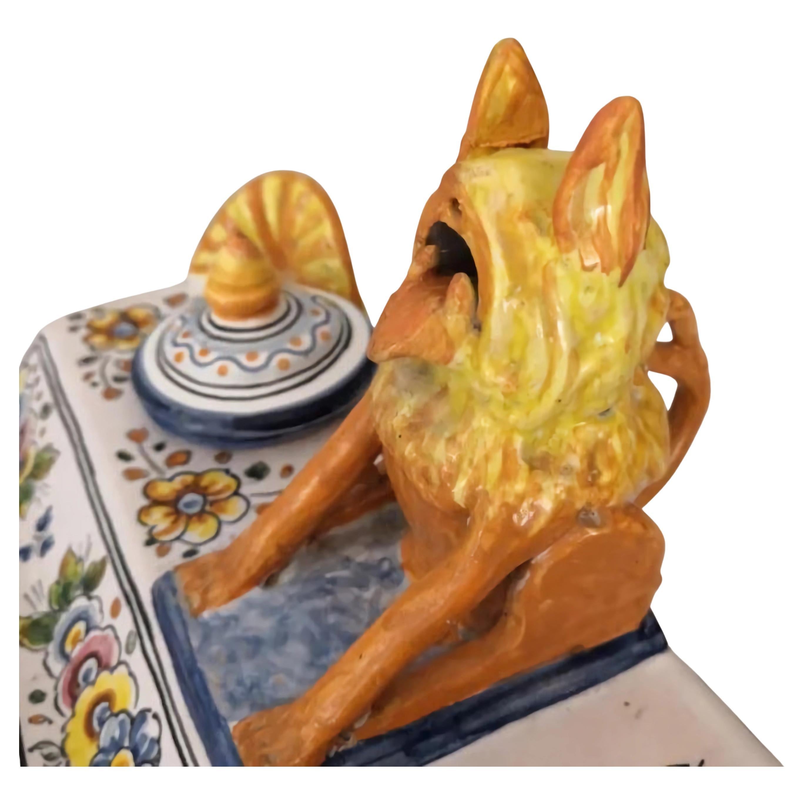 Decorative desk set in glazed Talavera ceramic made around the mid‑20th century, notable for its vibrant polychromy in cobalt blue, yellow, orange, and green on a white background. The piece features an architectural layout with an elevated base,