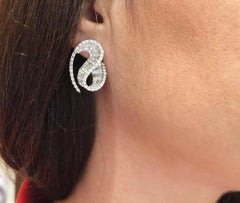 Talay Wave Diamond Earrings set in 18K White Gold Settings