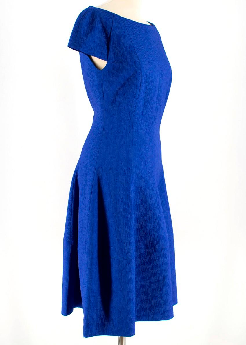 Talbot Runhof Blue Midlength Dress
- Textured blue fabric 
- Princess style dress
- Wide neck
- capped sleeves
- Fully lined 
- Invisible zip and hook down the back of the dress
- Flattering shape 

Materials 
Cotton Blend 

Made in Germany