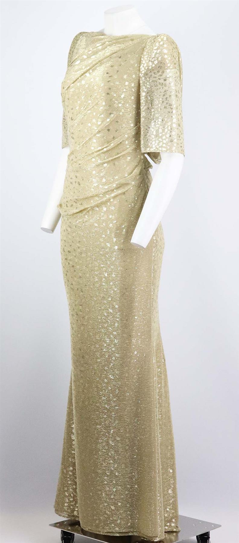 This gown by Talbot Runhof is cut for a close fit from gold voile and has lightly padded shoulders, the fluttery cape-effect sleeves tuck into the waistband, forming a vintage-style stole at the back. Metallic-gold cupro-blend. Zip fastening at