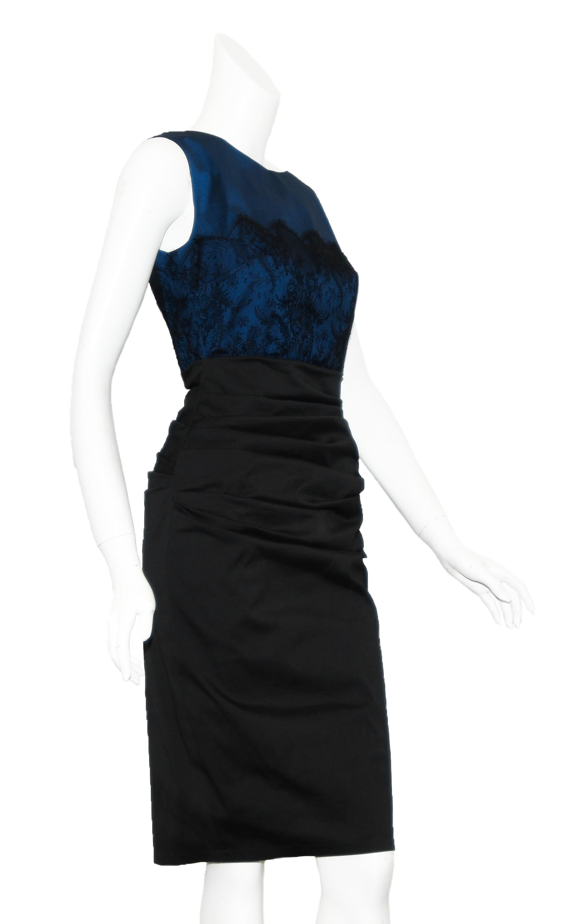 Talbot Runhof royal blue bodice with black lace overlay incorporates a bateau neckline.  This horizontal ruched dress has a fitted silhouette.   For closure a hidden zipper at back and finishes at the knee.  Dress is lined in black silk blend
