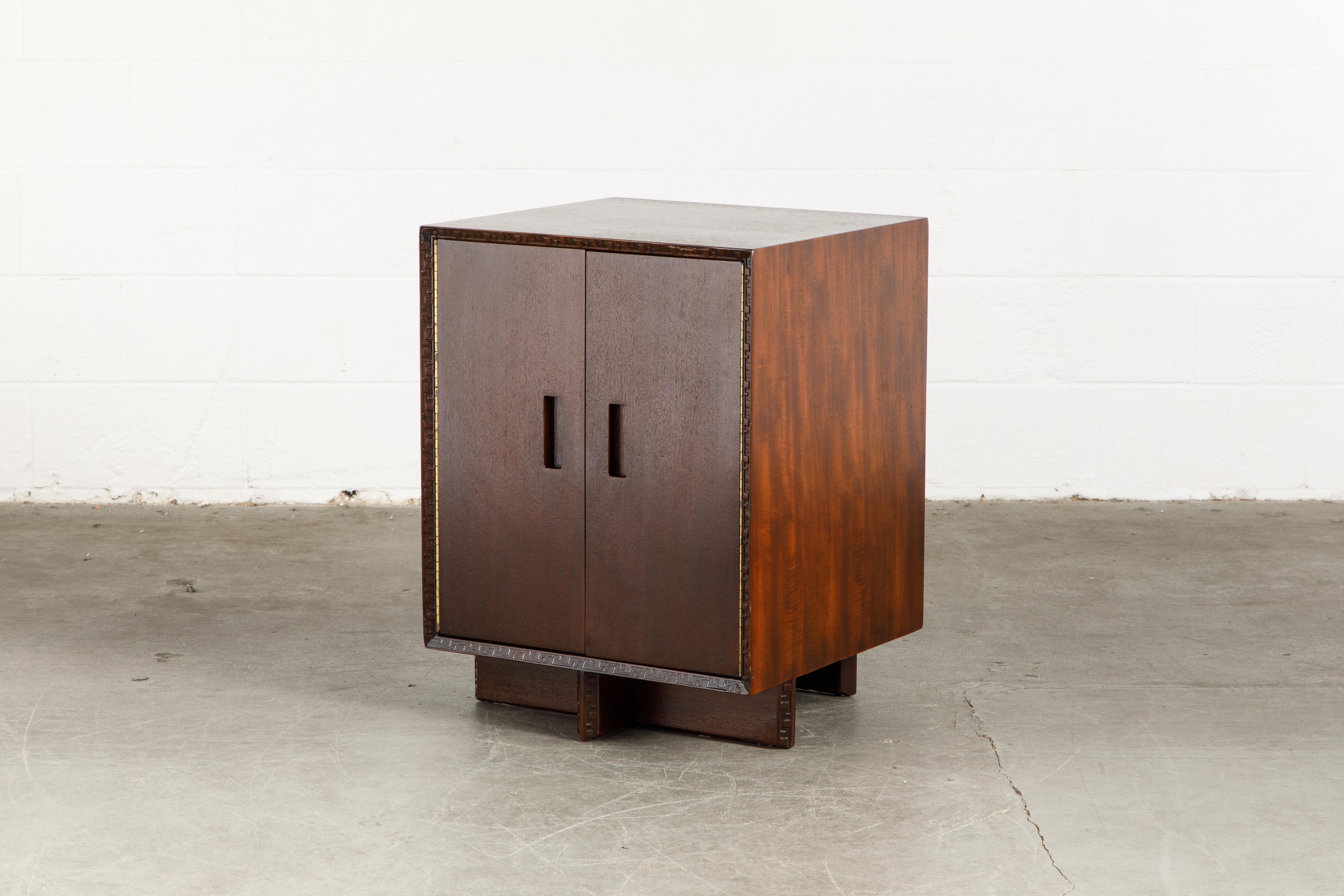 This gorgeously refinished Honduran Mahogany 'Taliesin' cabinet was designed by Frank Lloyd Wright for Heritage-Henredon in 1955 and produced only for two years, therefore are now highly sought-after and rare collectors items. This example is signed