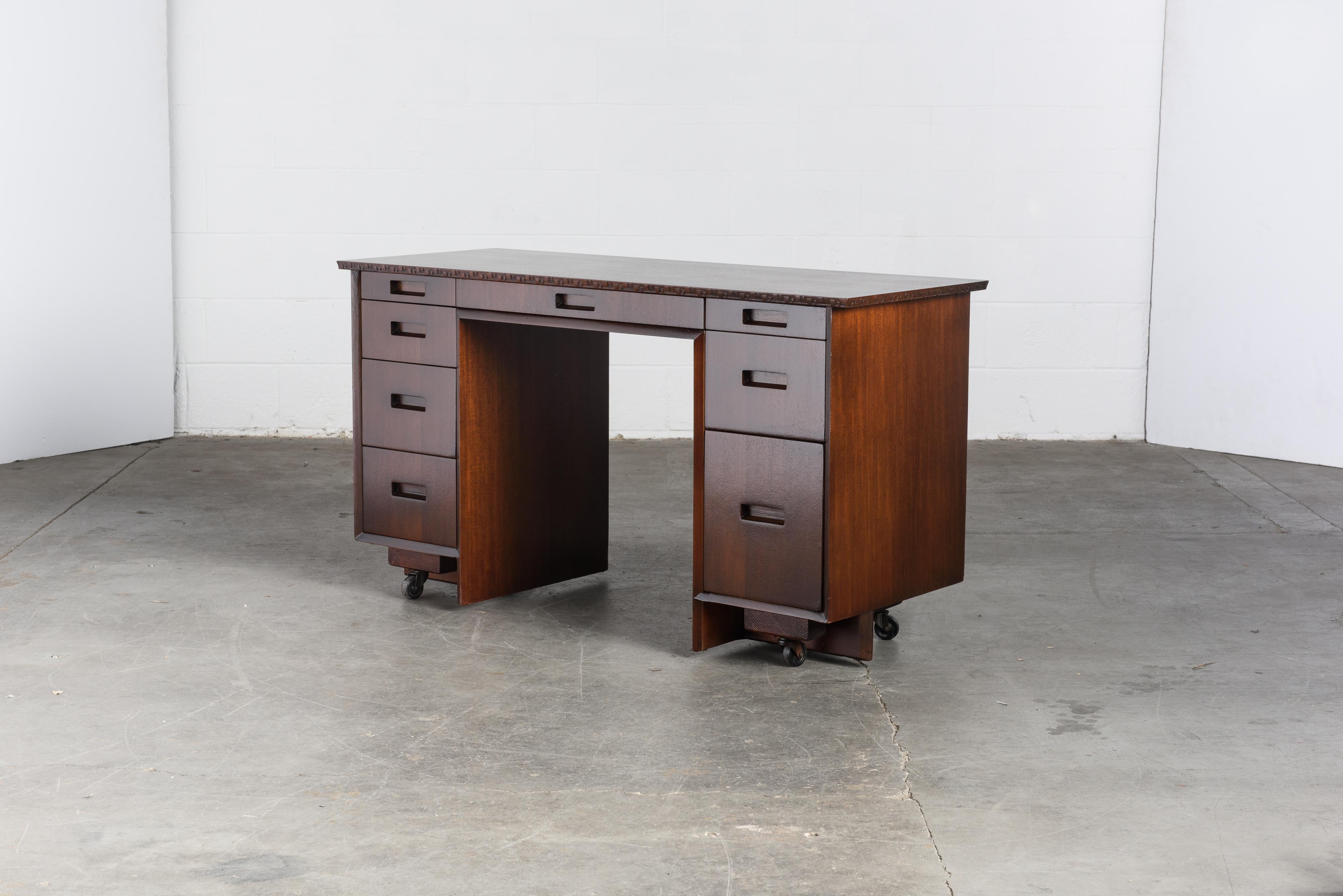 This gorgeously refinished Honduran Mahogany 'Taliesin' desk was designed by Frank Lloyd Wright for Heritage-Henredon in 1955 and produced only for two years, therefore is now a highly sought-after and rare collectors item. This example is signed