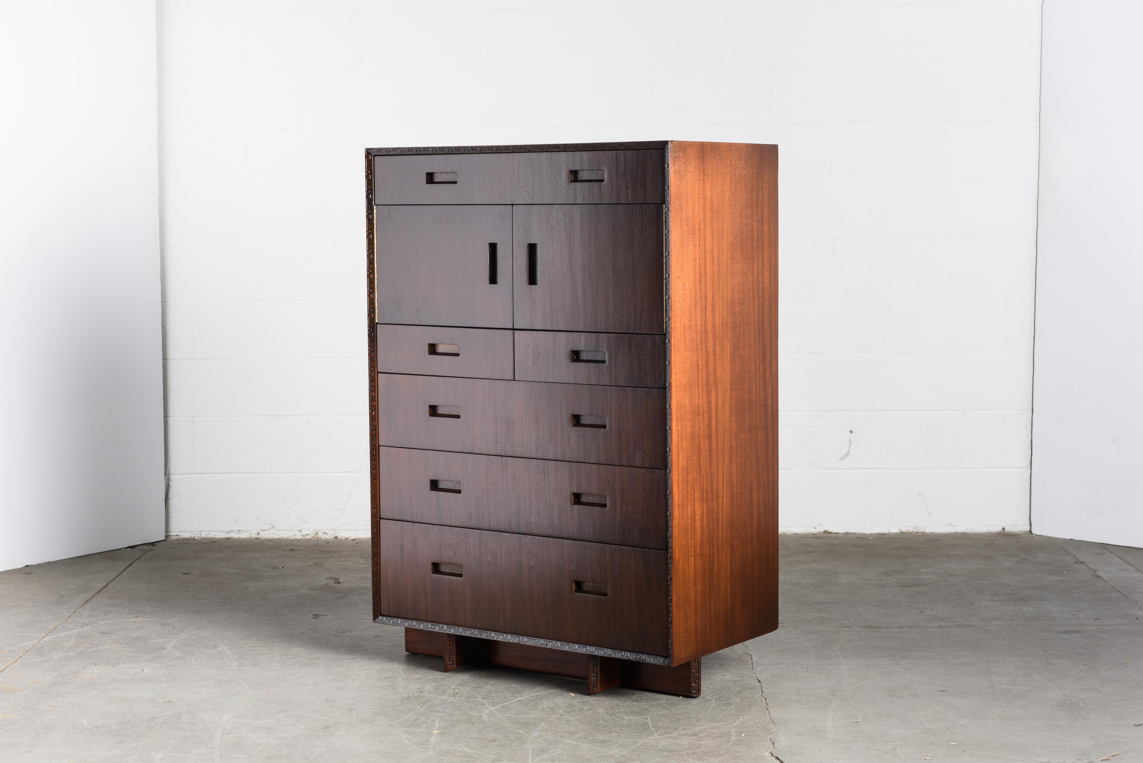 This gorgeously refinished Honduran Mahogany 'Taliesin' highboy dresser, Model #2000, was designed by Frank Lloyd Wright for Heritage-Henredon in 1955 and produced only for two years, therefore is now a highly sought-after and rare collectors item.