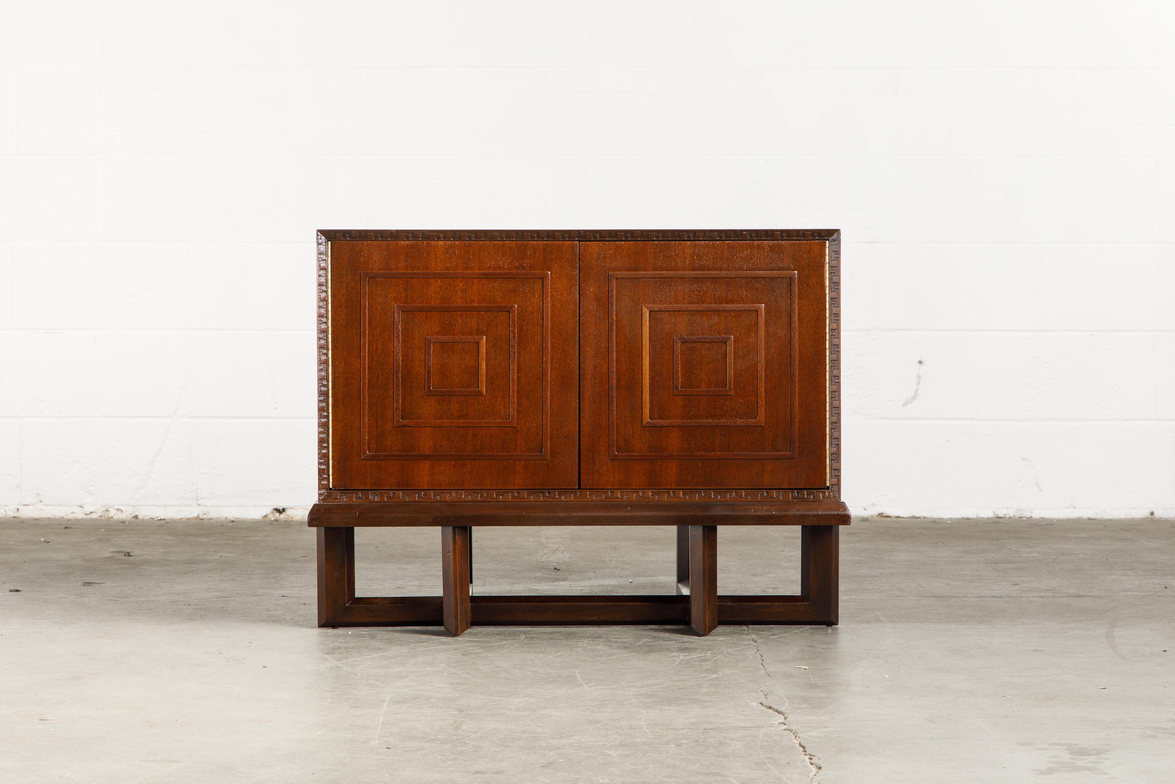 This gorgeously refinished Honduran Mahogany 'Taliesin' Model #2005 Special Cabinet on Stand was designed by Frank Lloyd Wright for Heritage-Henredon in 1955 and produced only for two years, therefore is now a highly sought-after and rare collectors