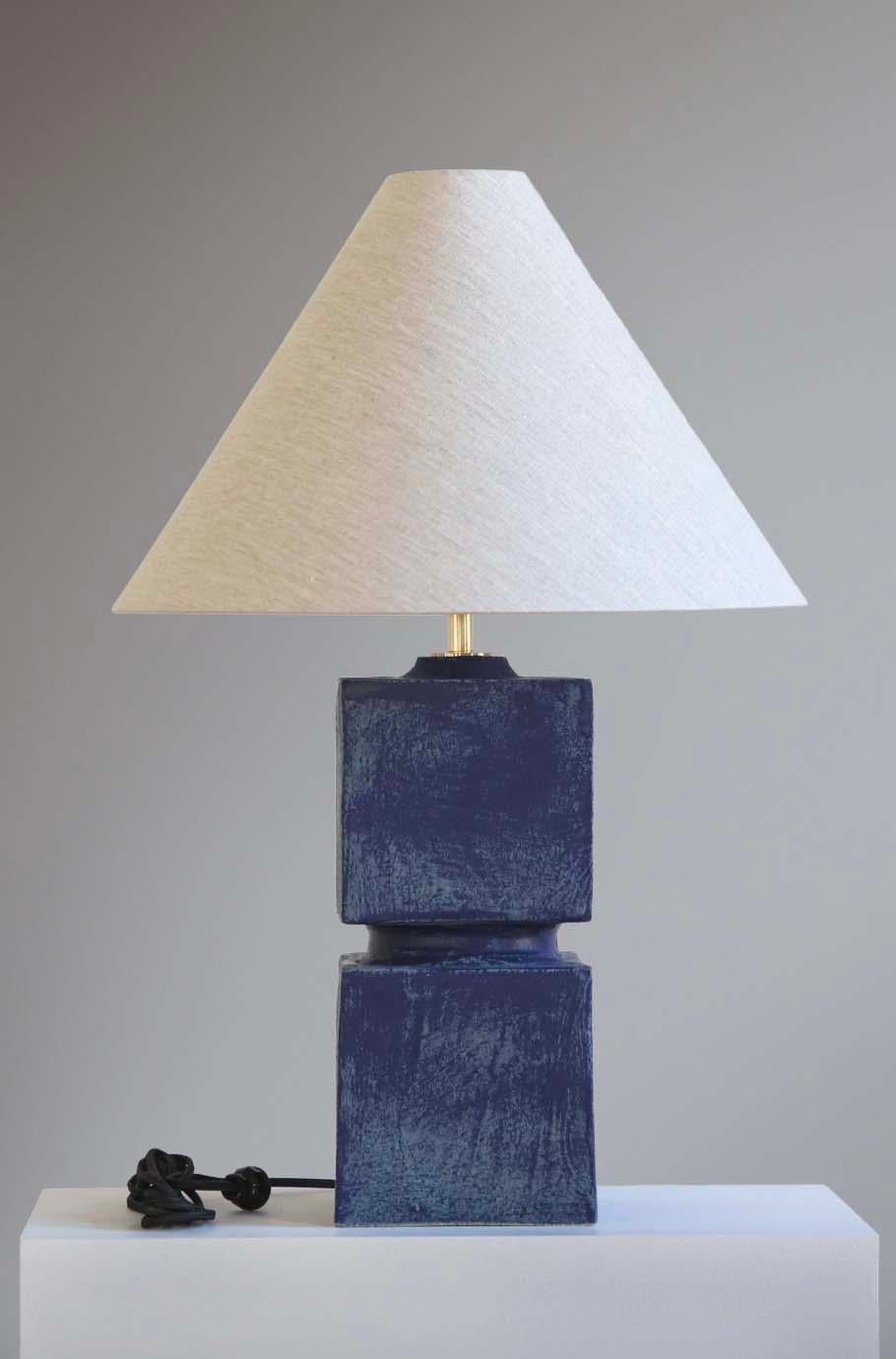The Talis lamp is handmade studio pottery by ceramic artist by Danny Kaplan. Shade included. Please note exact dimensions may vary.

Born in New York City and raised in Aix-en-Provence, France, Danny Kaplan’s passion for ceramics was shaped by