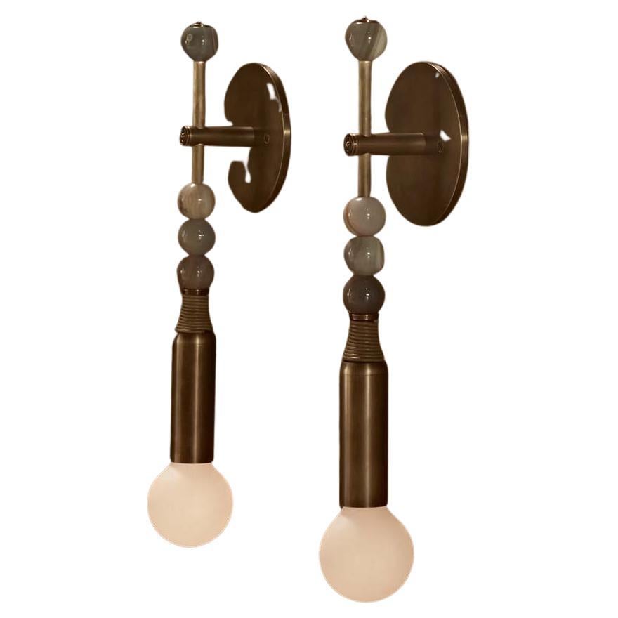 This unique sconce designed by Apparatus Studio in NYC evokes Statues of Persepolis and Moroccan Jewelry. It can be placed either in a home or a professional interior. You will be able to personalize your sconce to better fit your decoration, tastes
